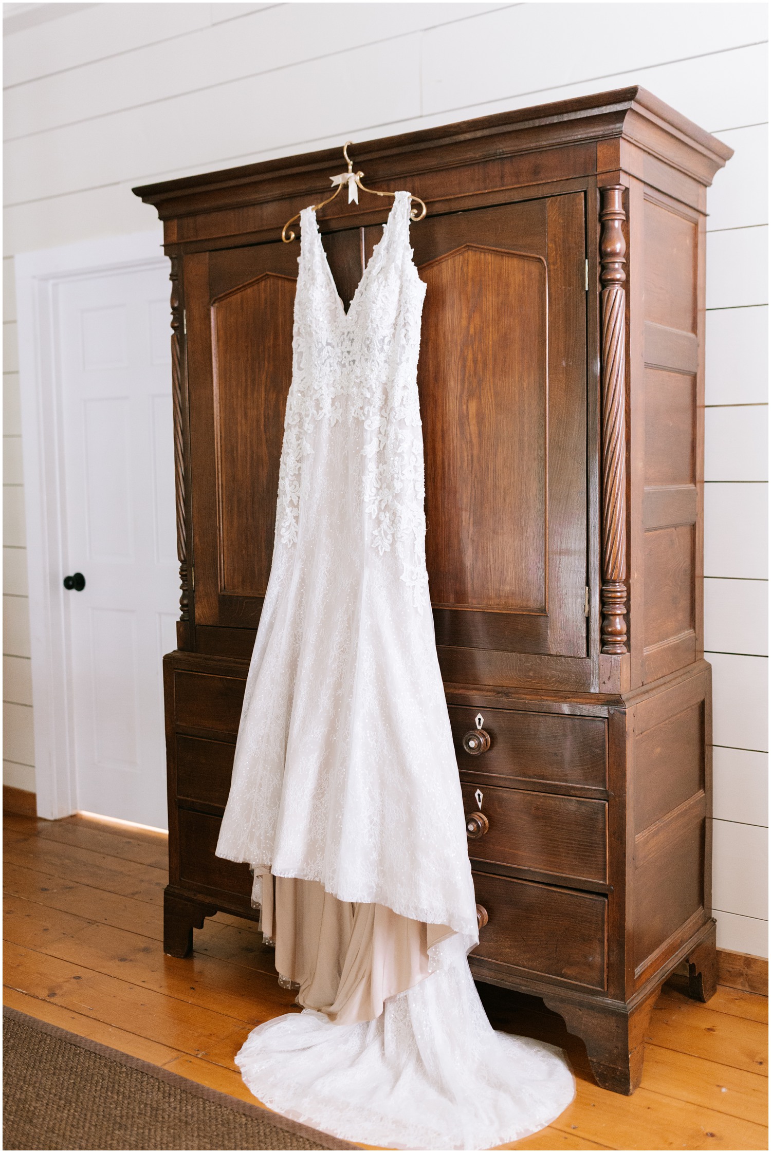 wedding dress hangs on armoire before Old Edwards Inn wedding