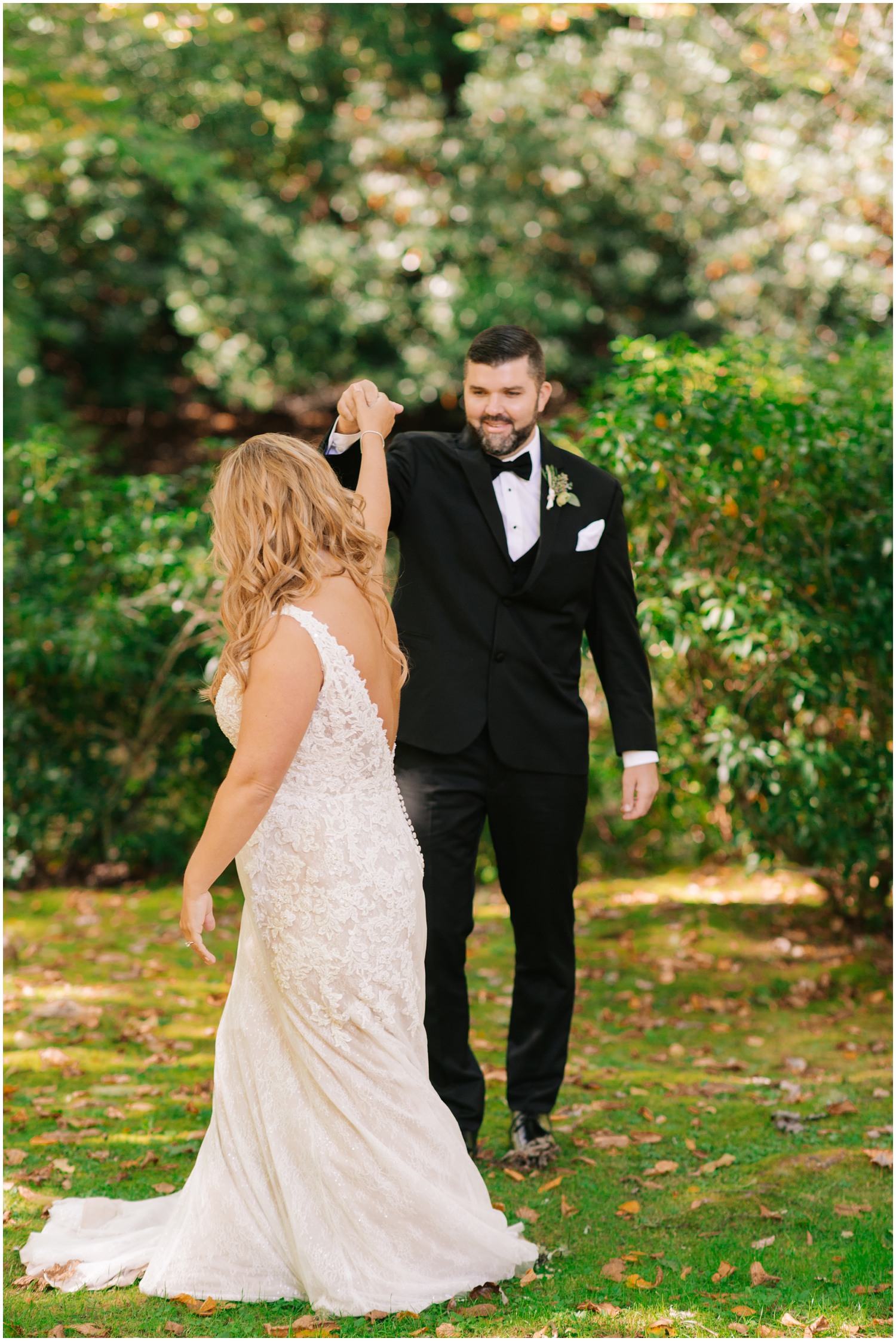 groom twirls bride during first look at Old Edwards Inn 