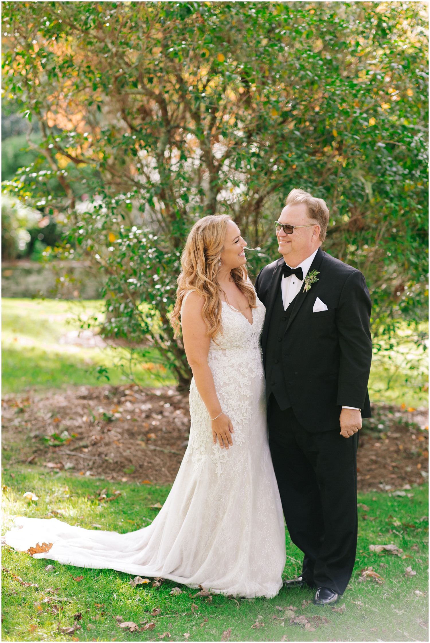 dad smiles at bride during first look portraits 
