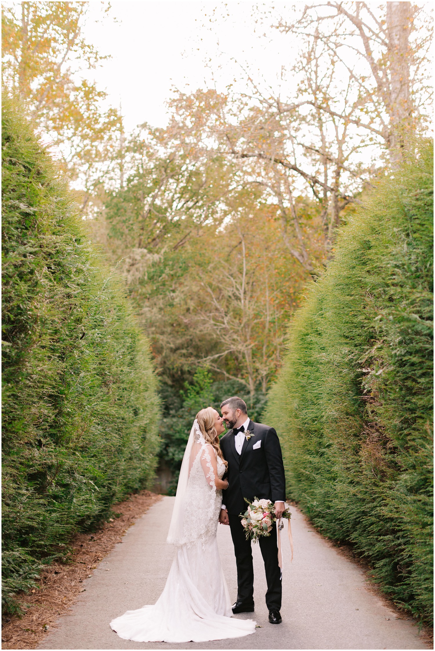 fall Wedding portrait of bride and groom kissing at Old Edwards Inn 
