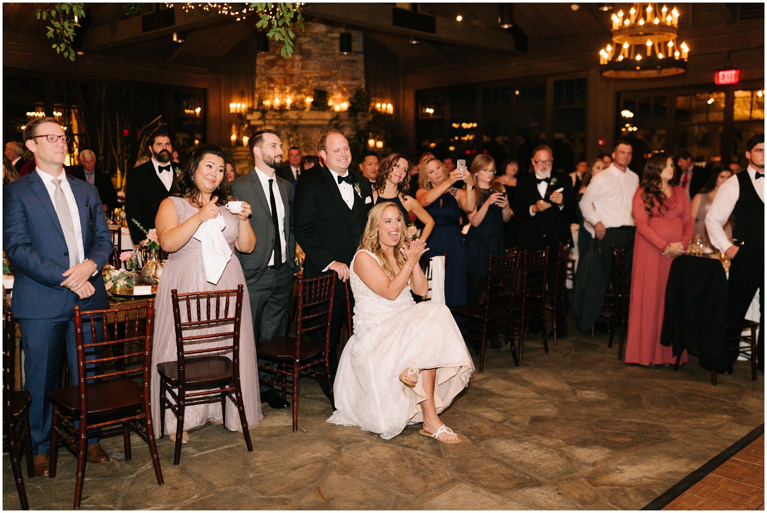 bride watches mother-son dance at Old Edwards Inn wedding reception