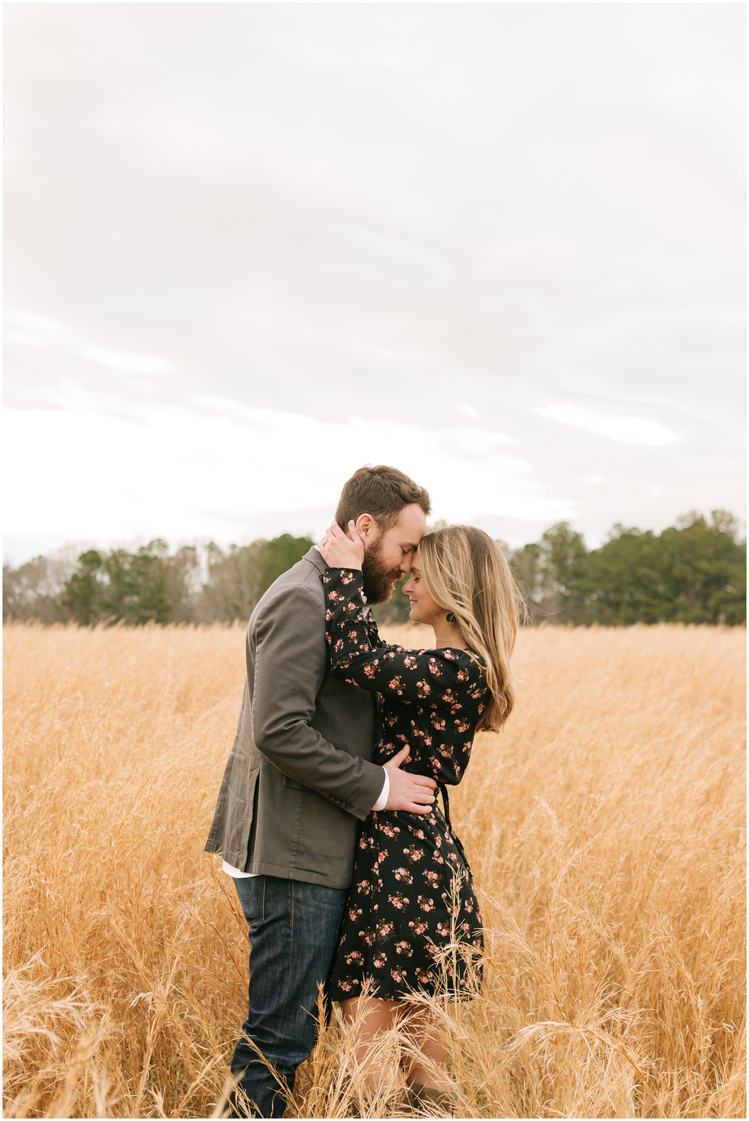 North Carolina engagement portraits in the field of The Meadows Raleigh