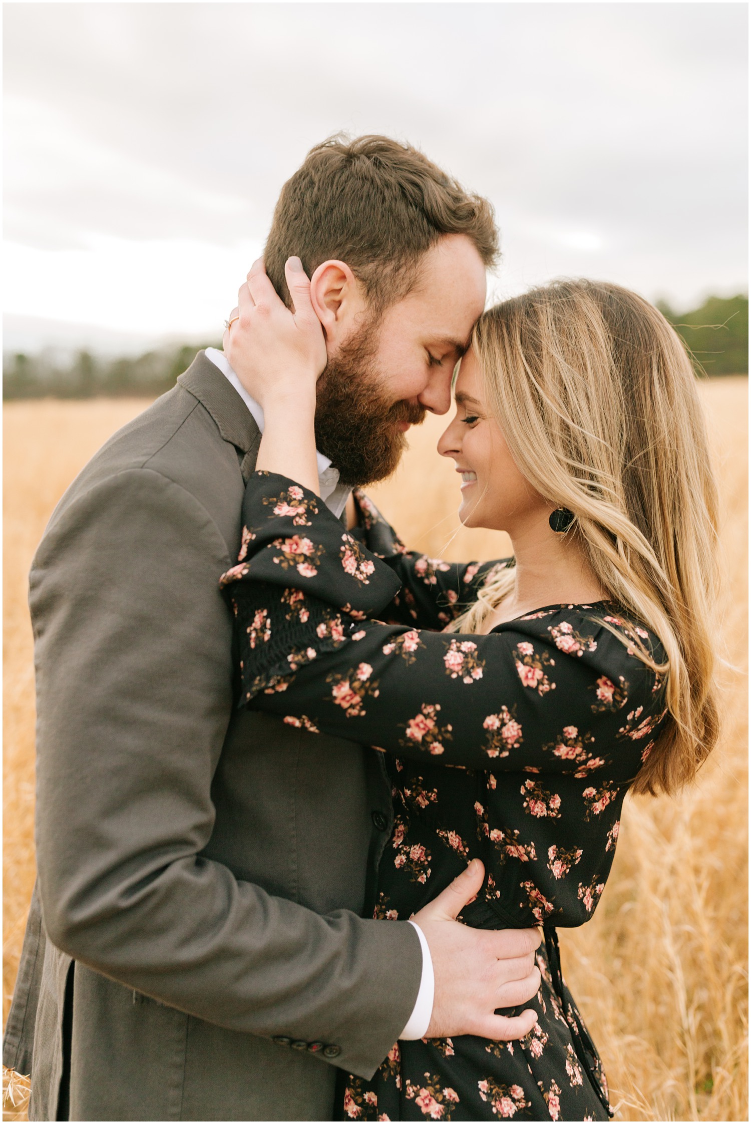 bride and groom touch foreheads during engagement portraits in NC