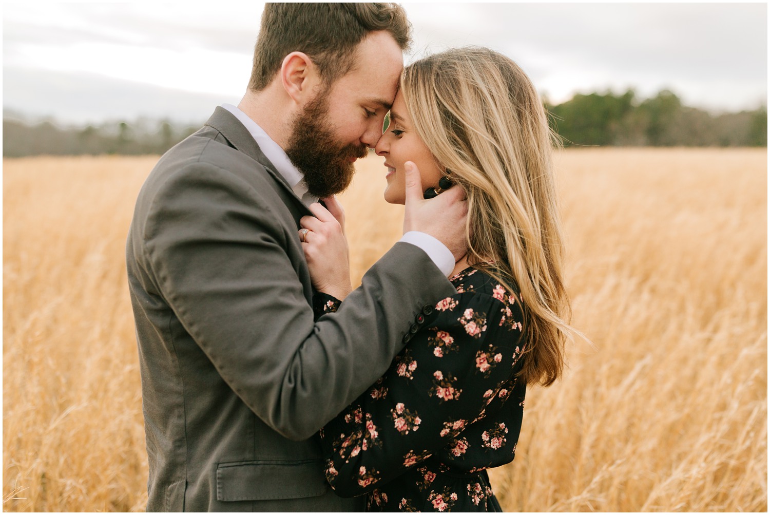 engagement portraits in the field at The Meadows Raleigh