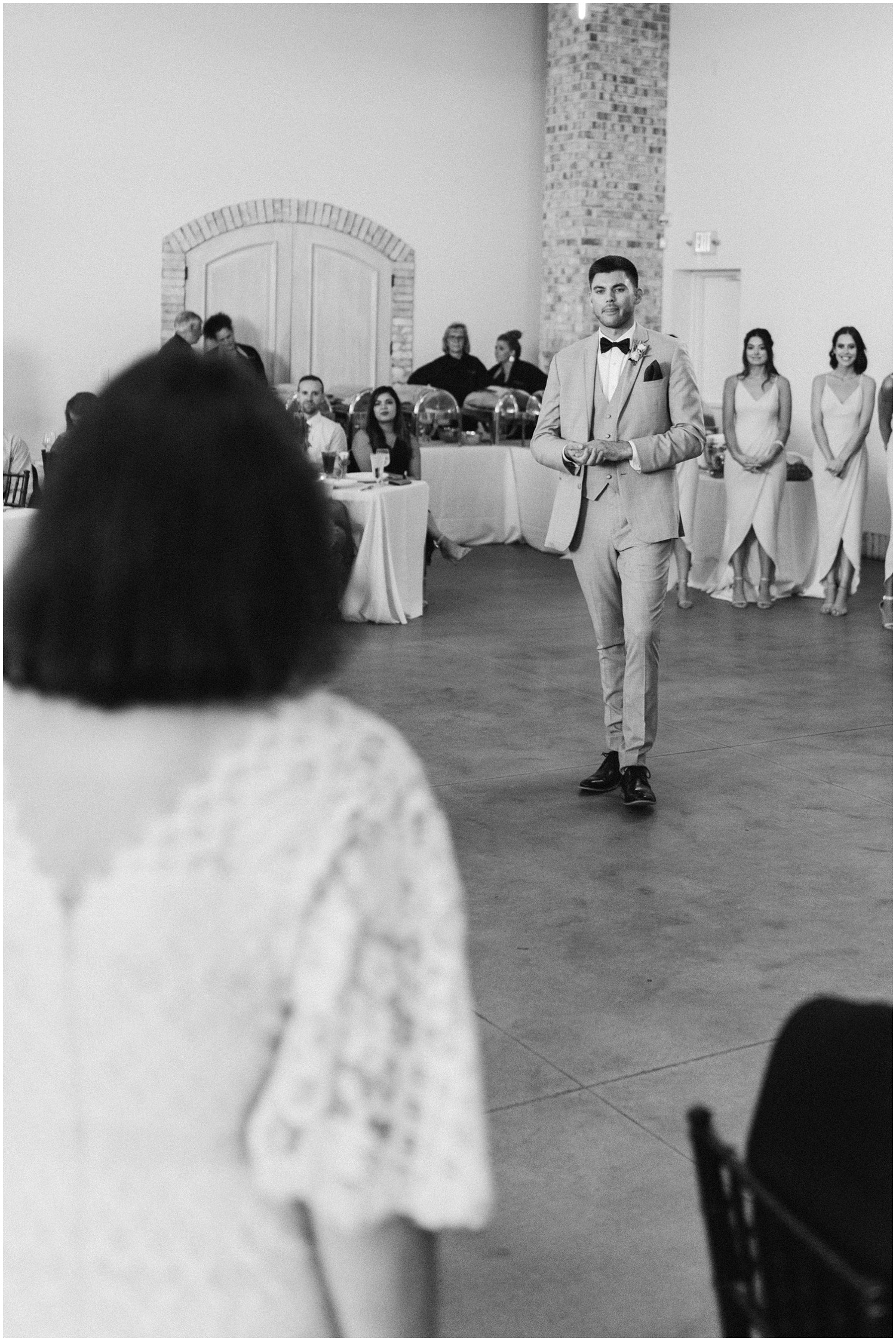 groom walks to get mom during Wrightsville Manor wedding reception