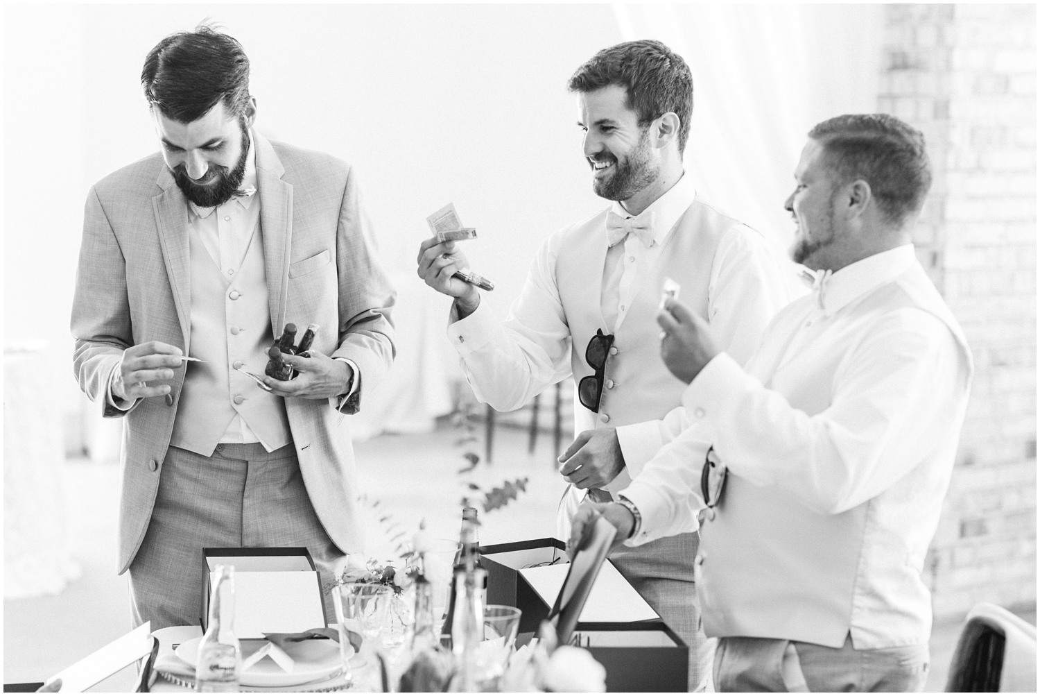 groom and groomsmen open gifts at Wrightsville Manor