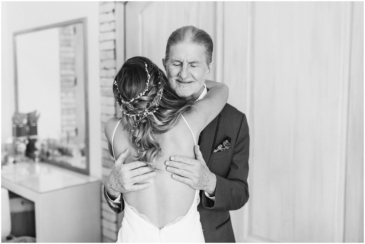 bride hugs dad during first look on Wilmington NC wedding 