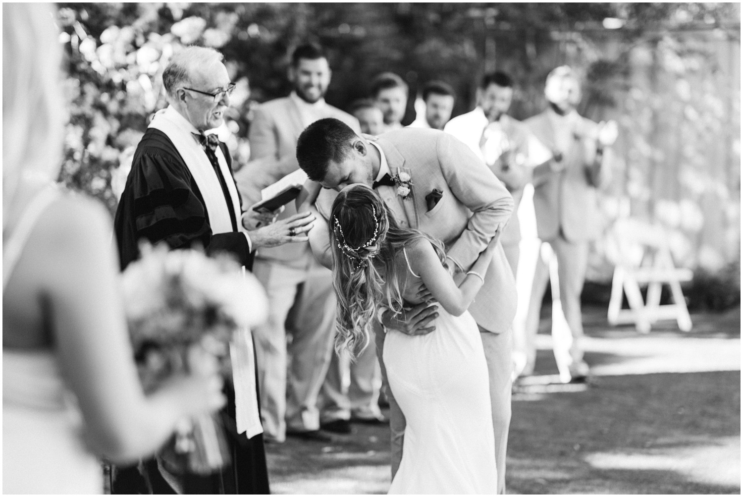 groom dips bride during wedding ceremony at Wrightsville Manor