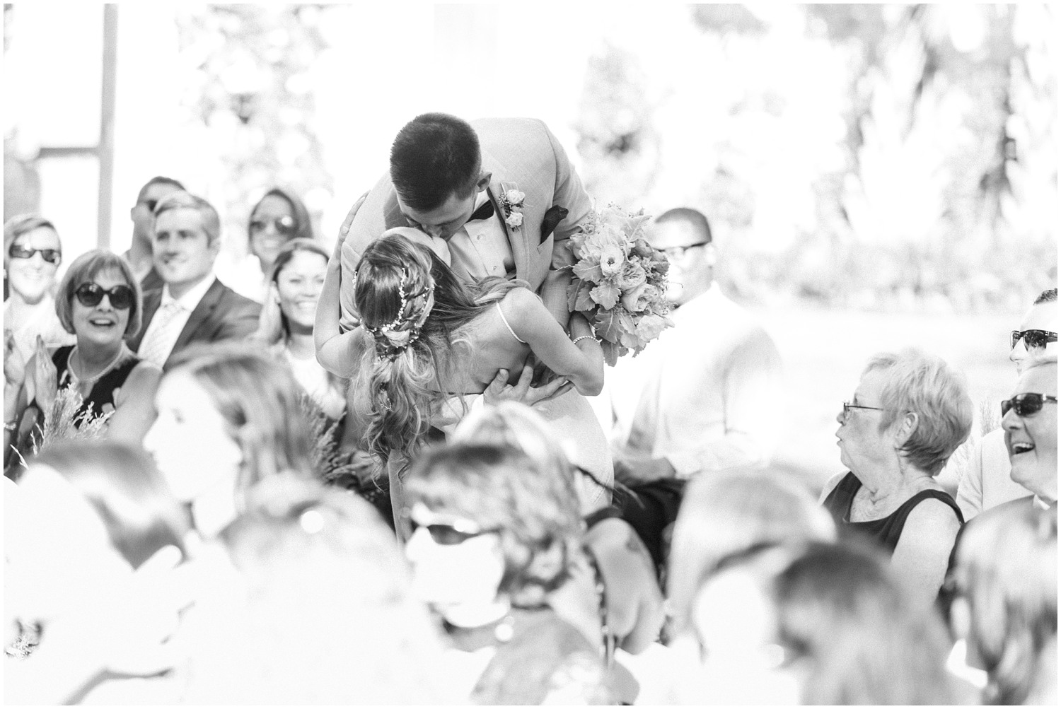 groom dips bride after Wrightsville Manor wedding ceremony