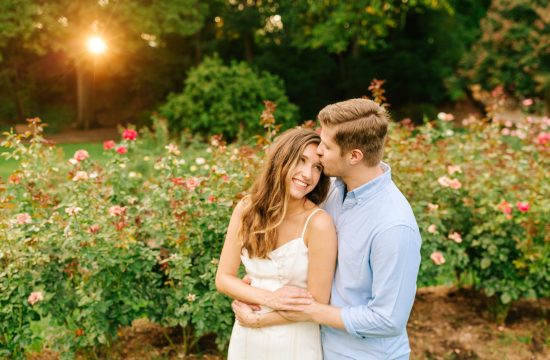A Winston Salem Wedding Photographer captures colorful and fun engagement photos of a couple at Raleigh Rose Garden
