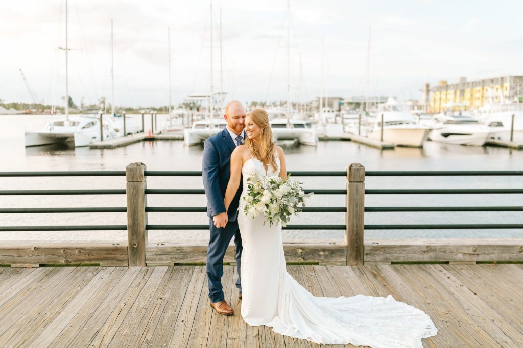 Wilmington NC wedding portraits on docks in front of sailboats 