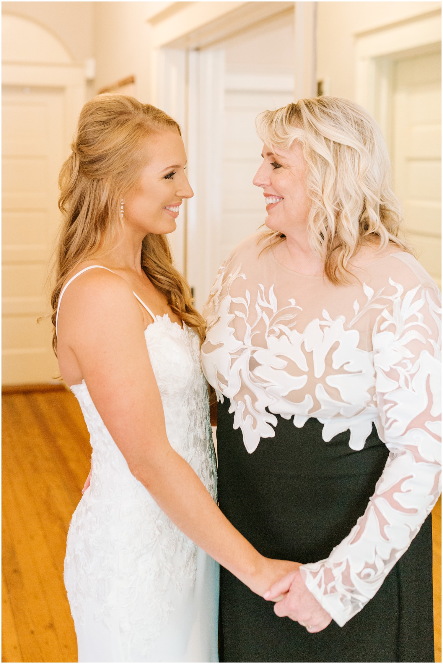 bride poses with mother before Brooklyn Arts Center wedding