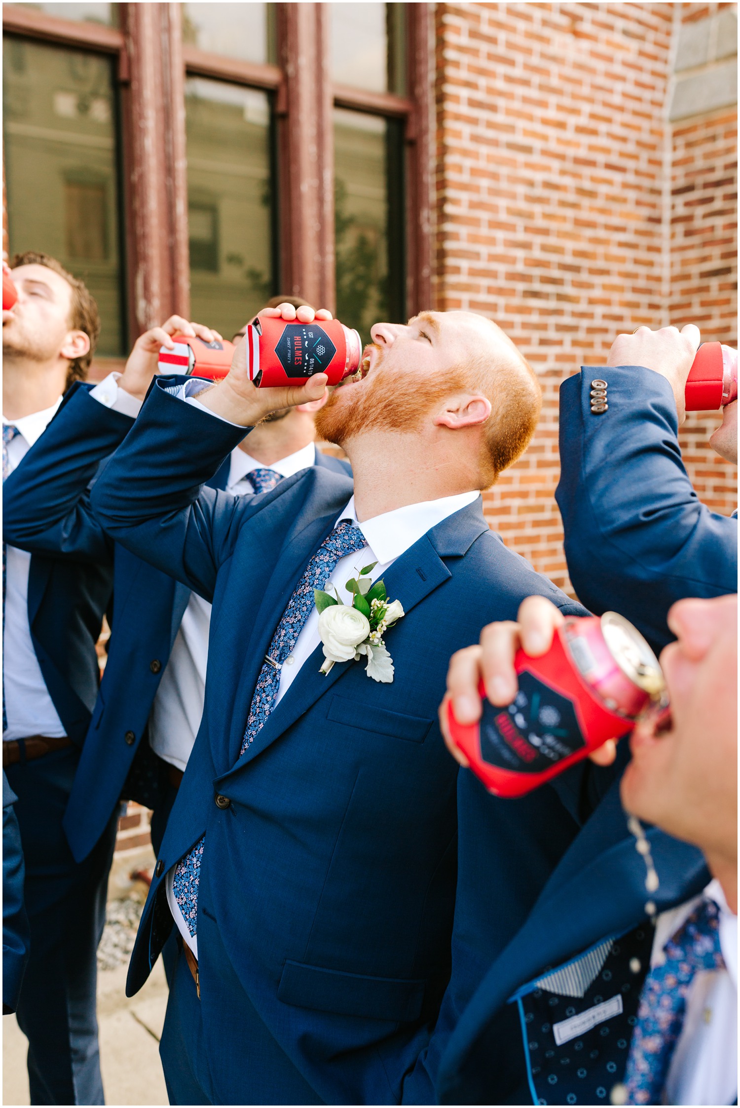 groomsmen drink beer out of custom koozies on NC wedding day