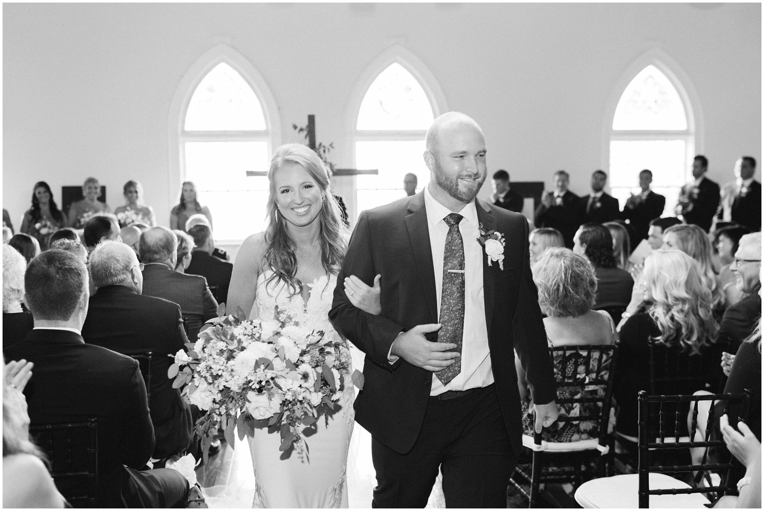 bride and groom walk up aisle after Brooklyn Arts Center wedding ceremony 