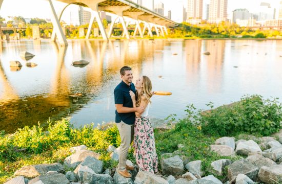 Richmond Wedding Photographer documents engagement photos in downtown Richmond at Sunset with the city skyline visible in the background