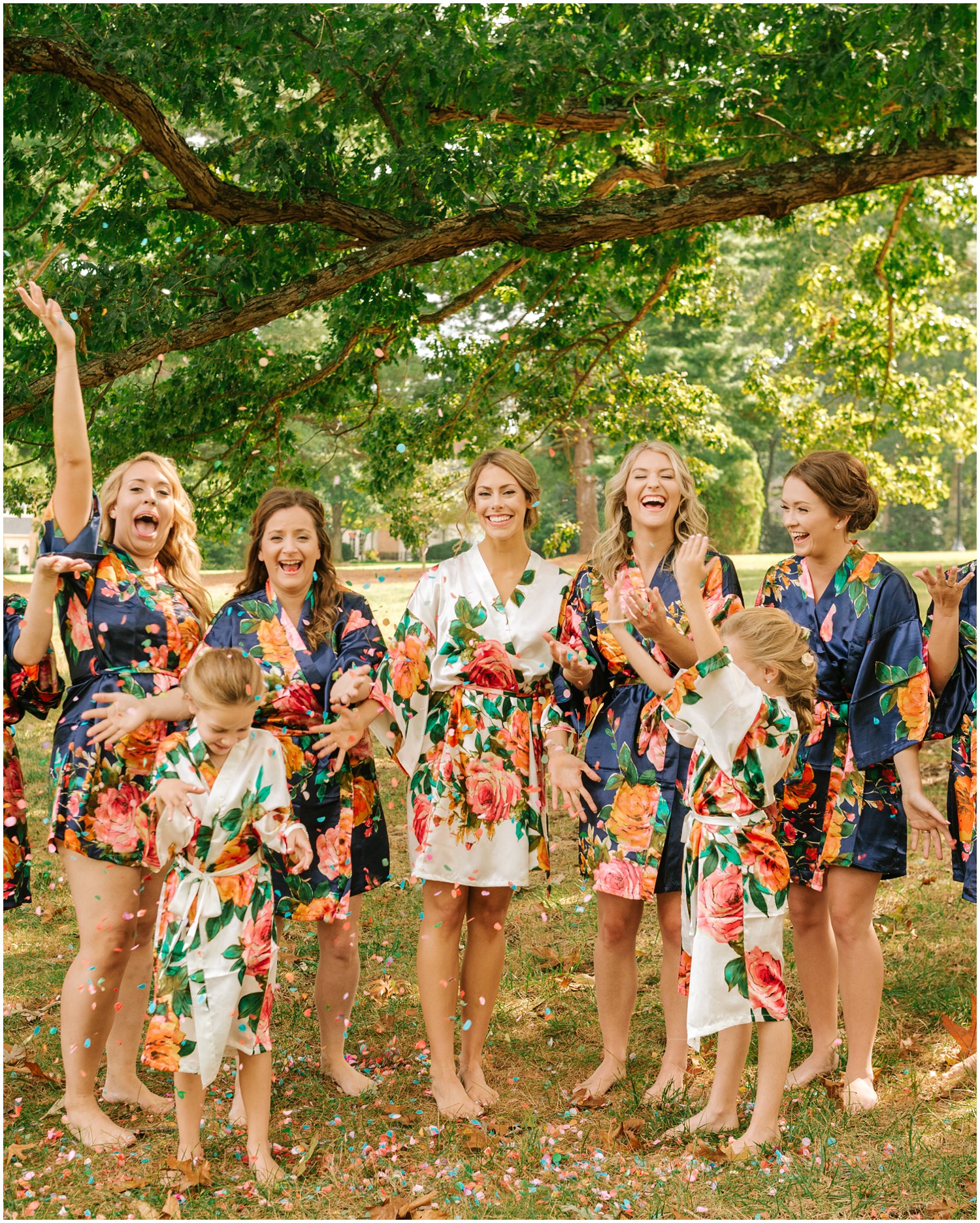 bridesmaids throw confetti while getting ready for Graylyn Estate wedding