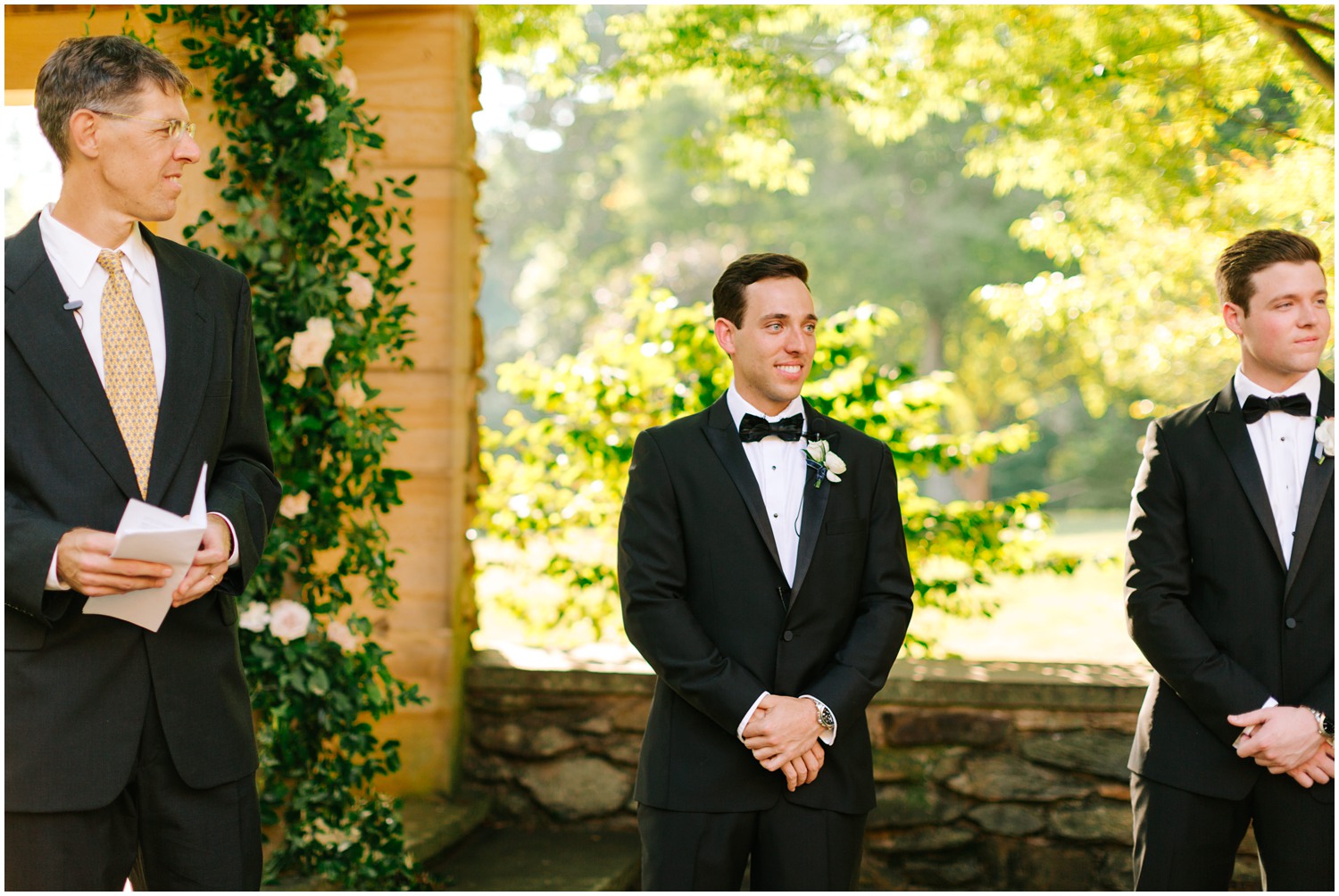 groom watches bride walk down aisle at Graylyn Estate