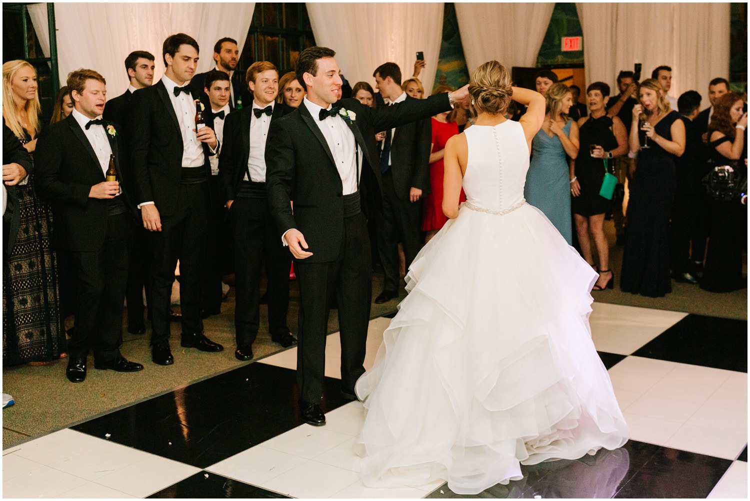 groom twirls bride during first dance at Graylyn Estate wedding reception