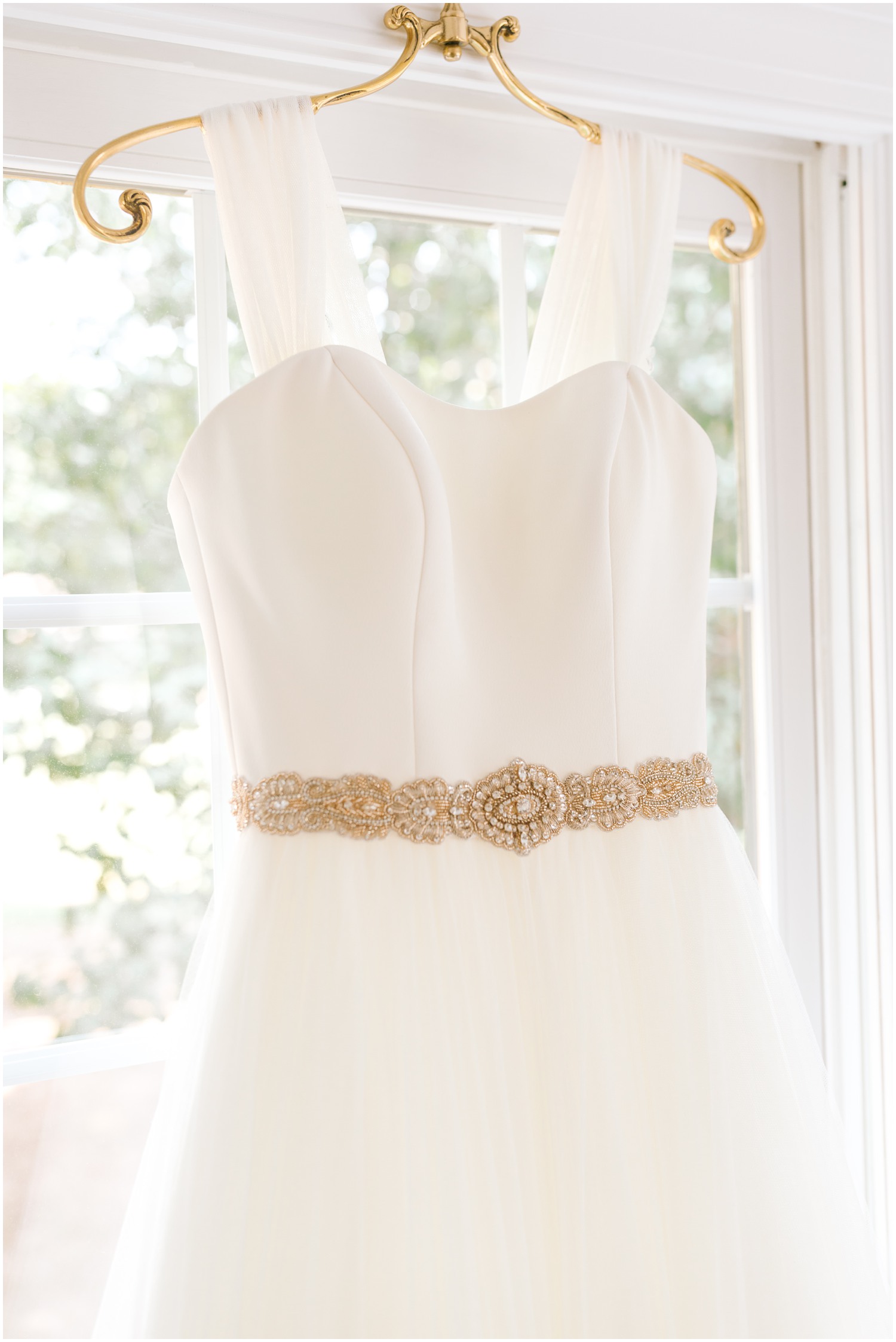 classic wedding gown with belt photographed by Chelsea Renay