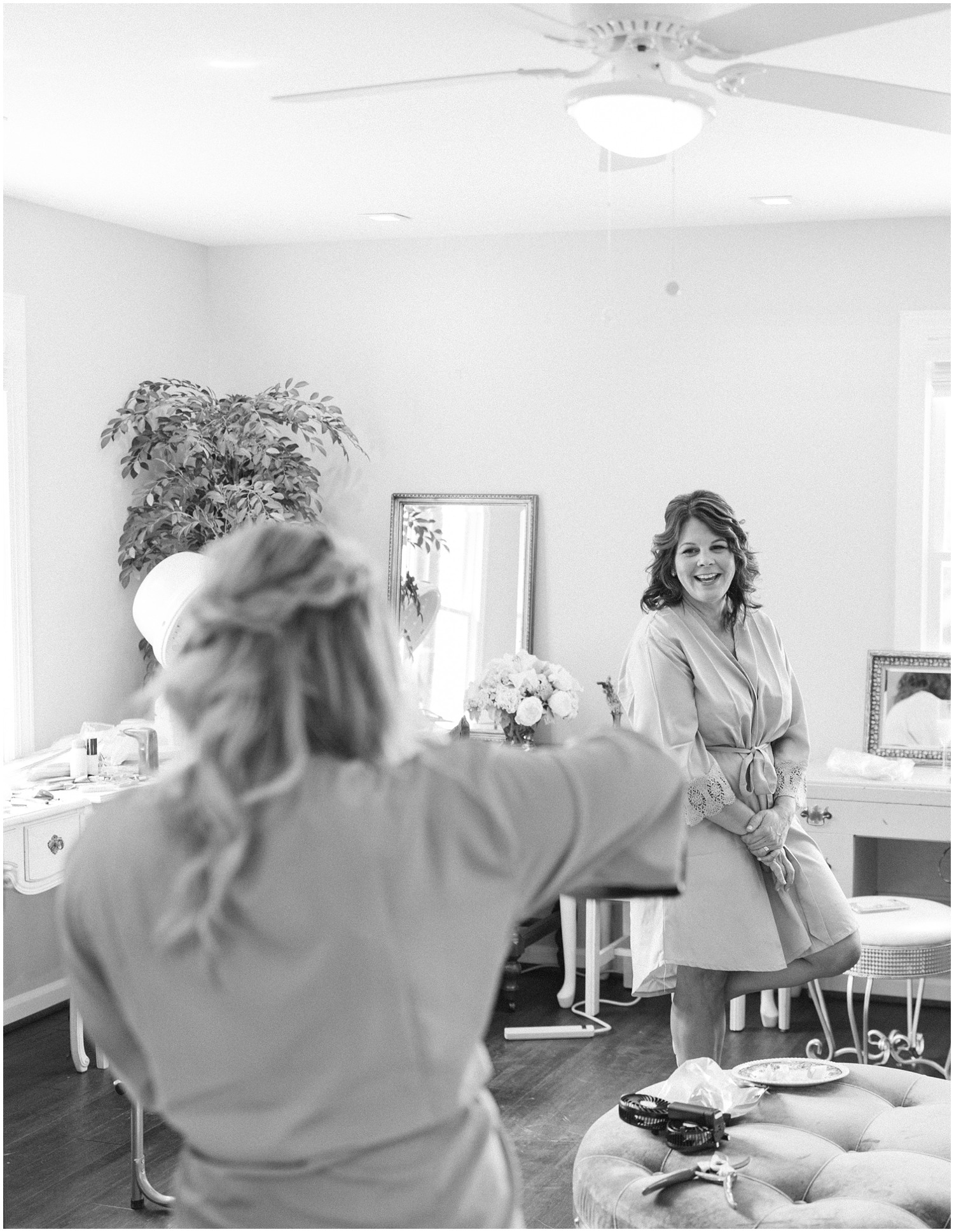mother of the bride gets ready for wedding day with bride