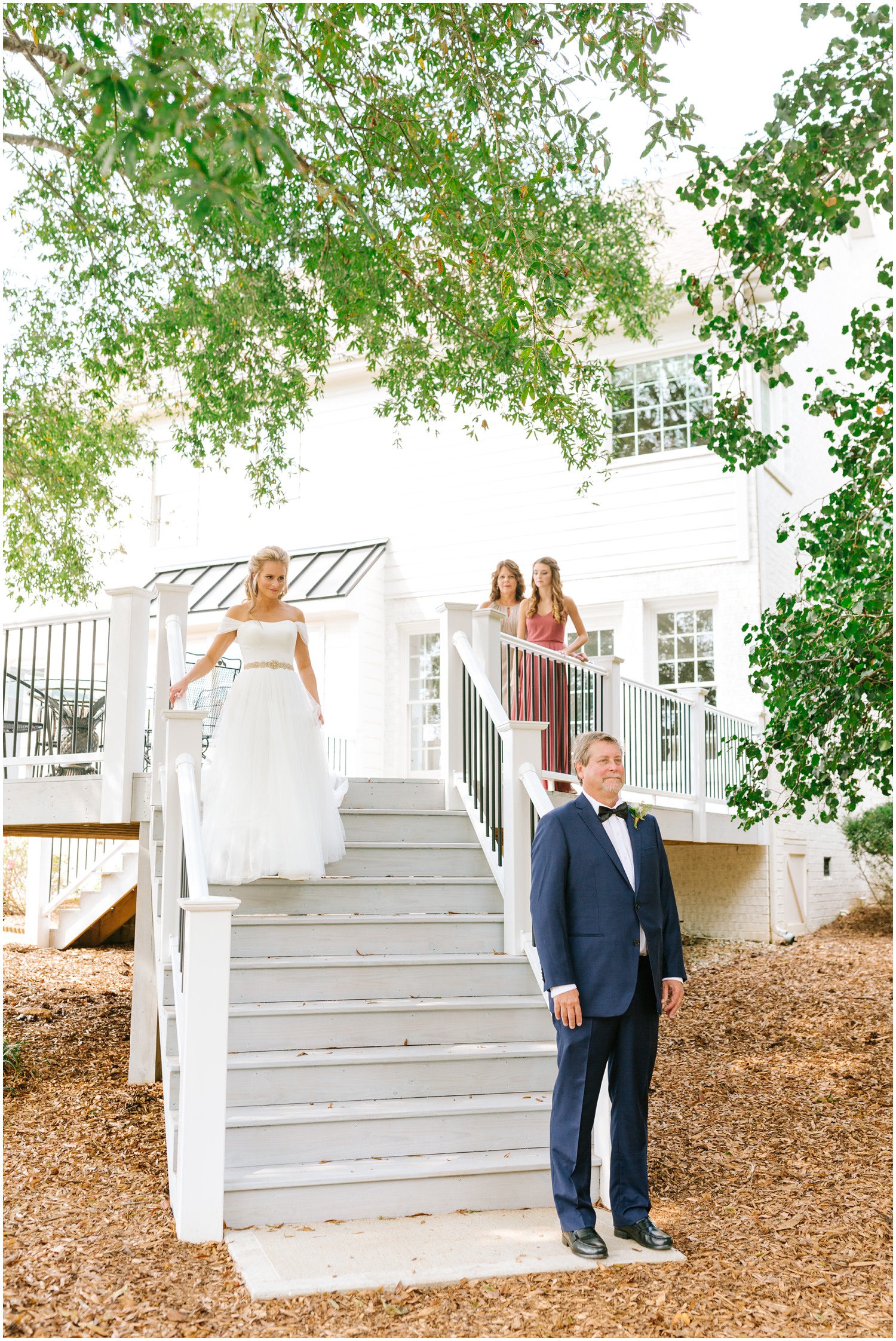 first look with bride and dad, bride walks down steps
