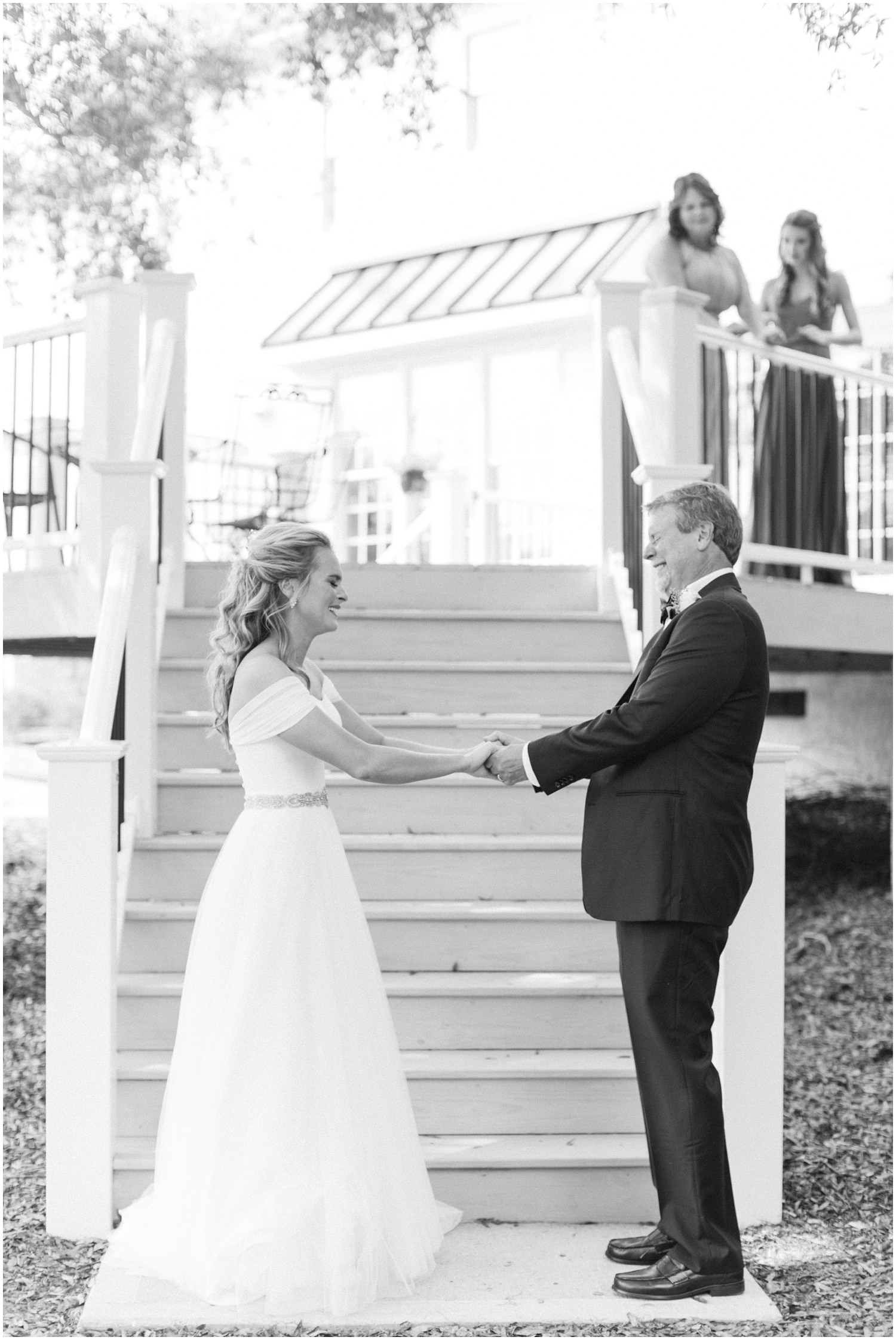 bride and father have emotional first look while mom and sister watch