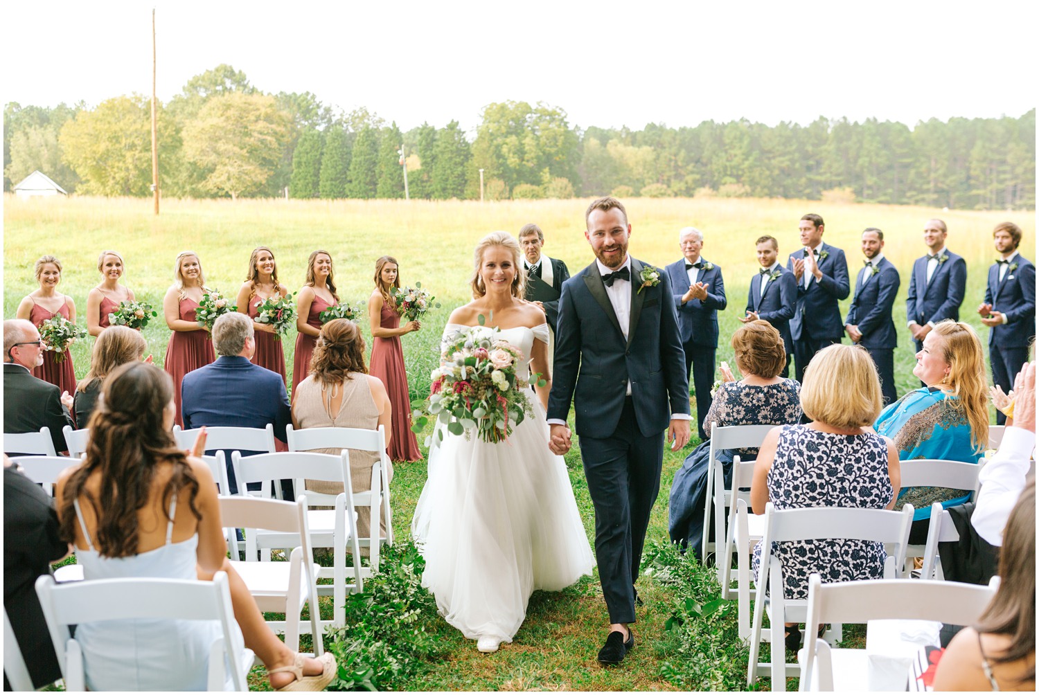 bride and groom recess up aisle after saying vows