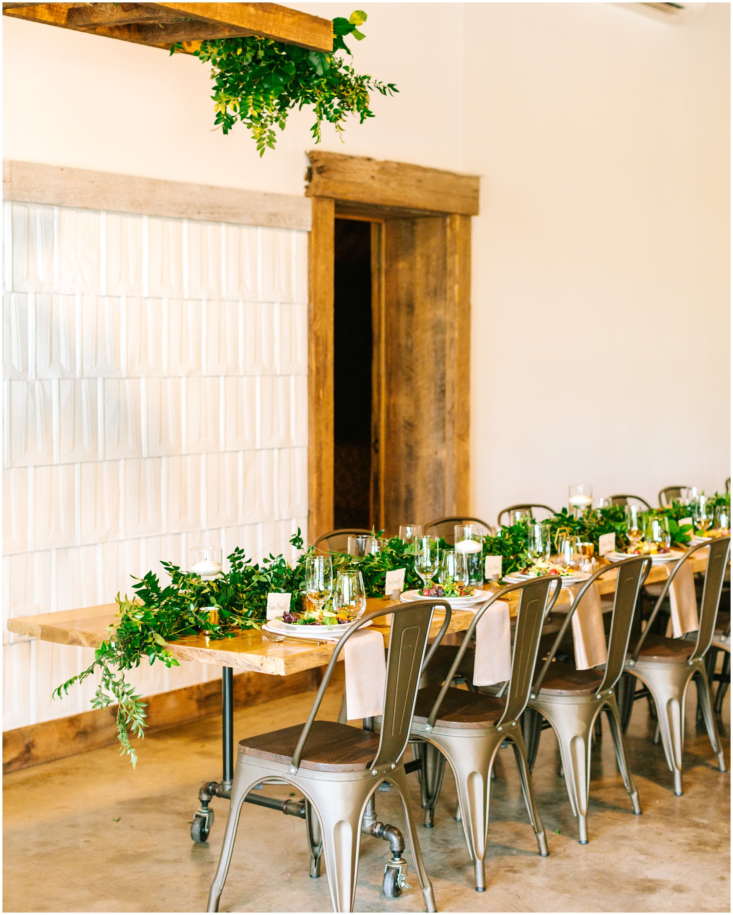 modern wedding reception tablescape with greenery