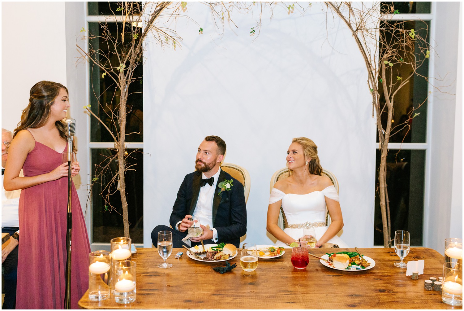 bridesmaid gives toast to bride and groom during NC reception 