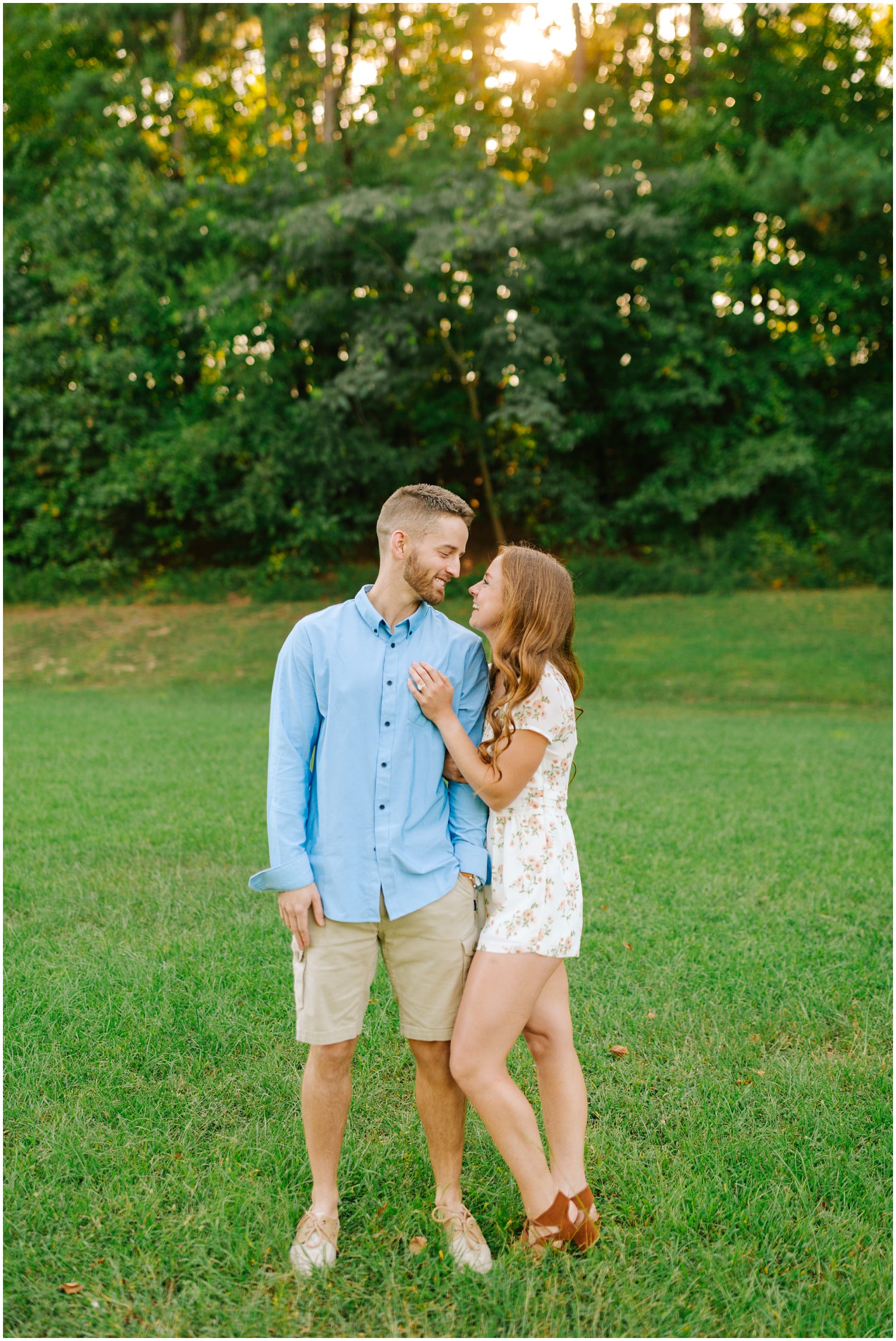 bride and groom laugh during sunset engagement photos