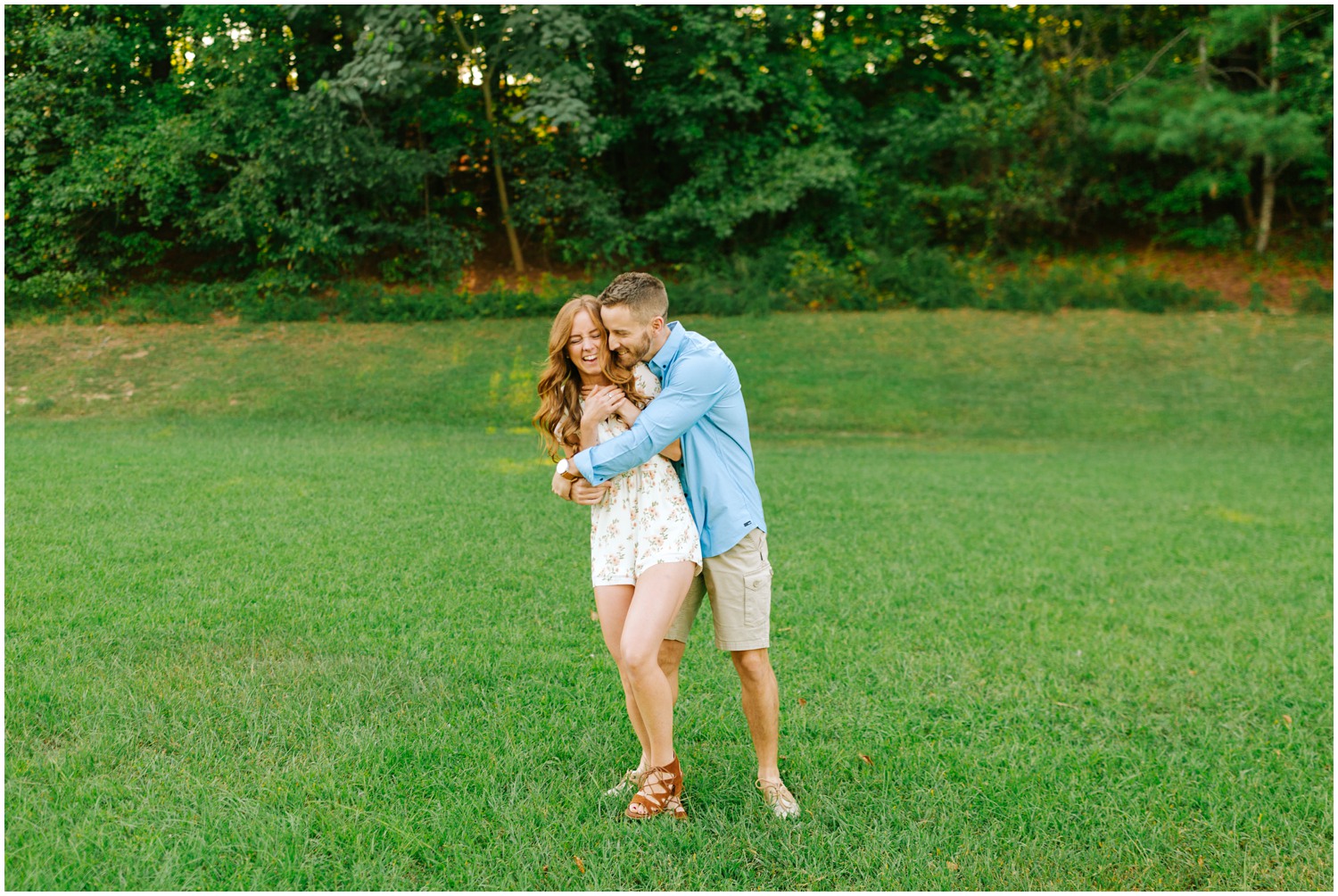 groom hugs bride during engagement session in Raleigh