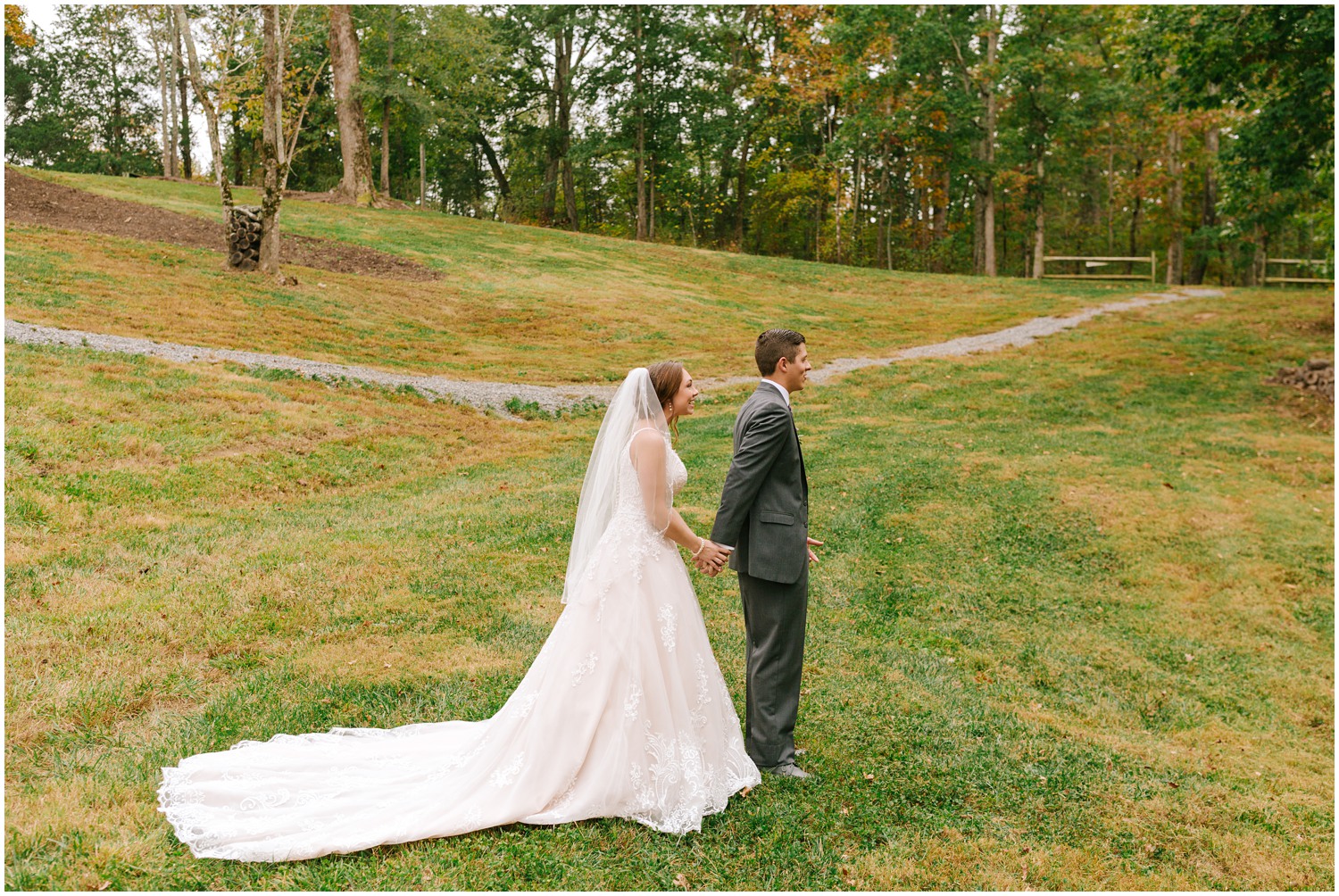 bride touches groom's hands during first look