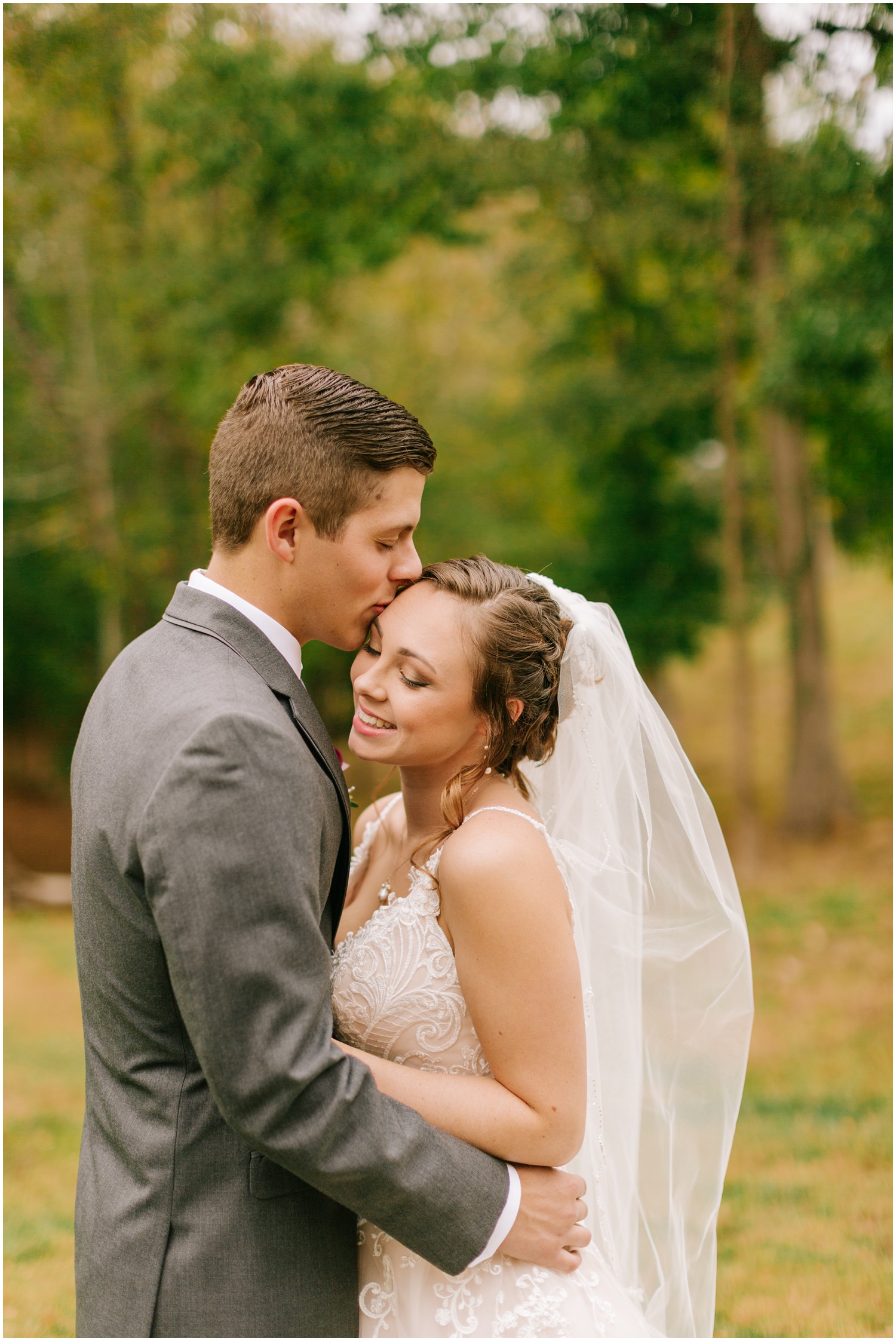 groom kisses bride before Medaloni Cellars wedding