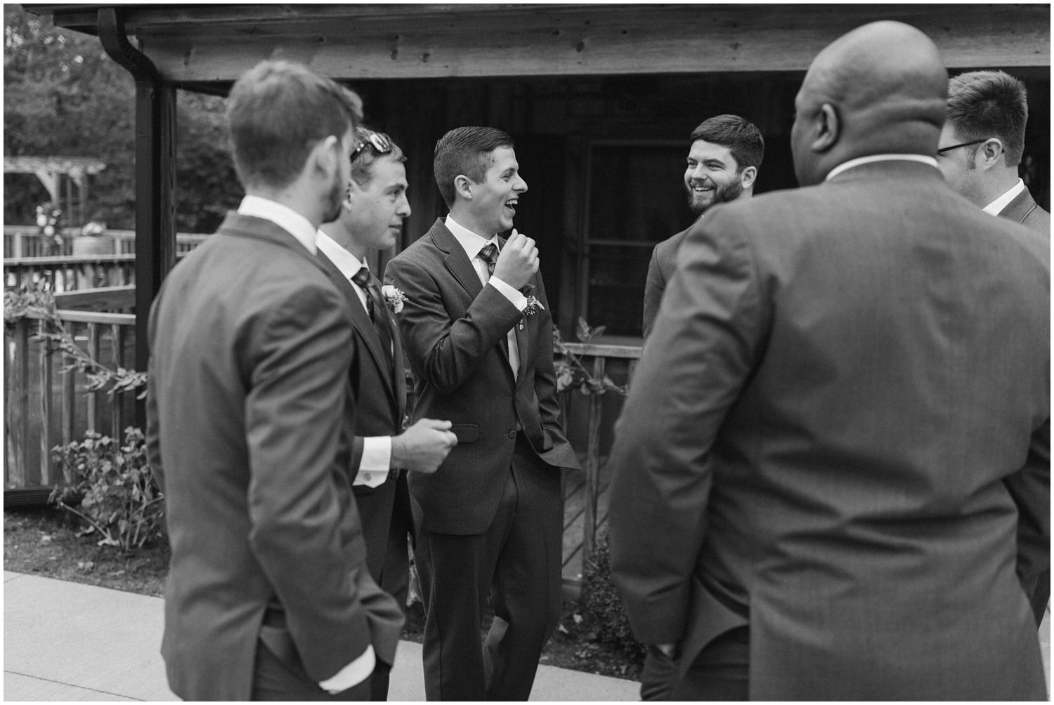 groomsmen talk before fall wedding at Medaloni Cellars