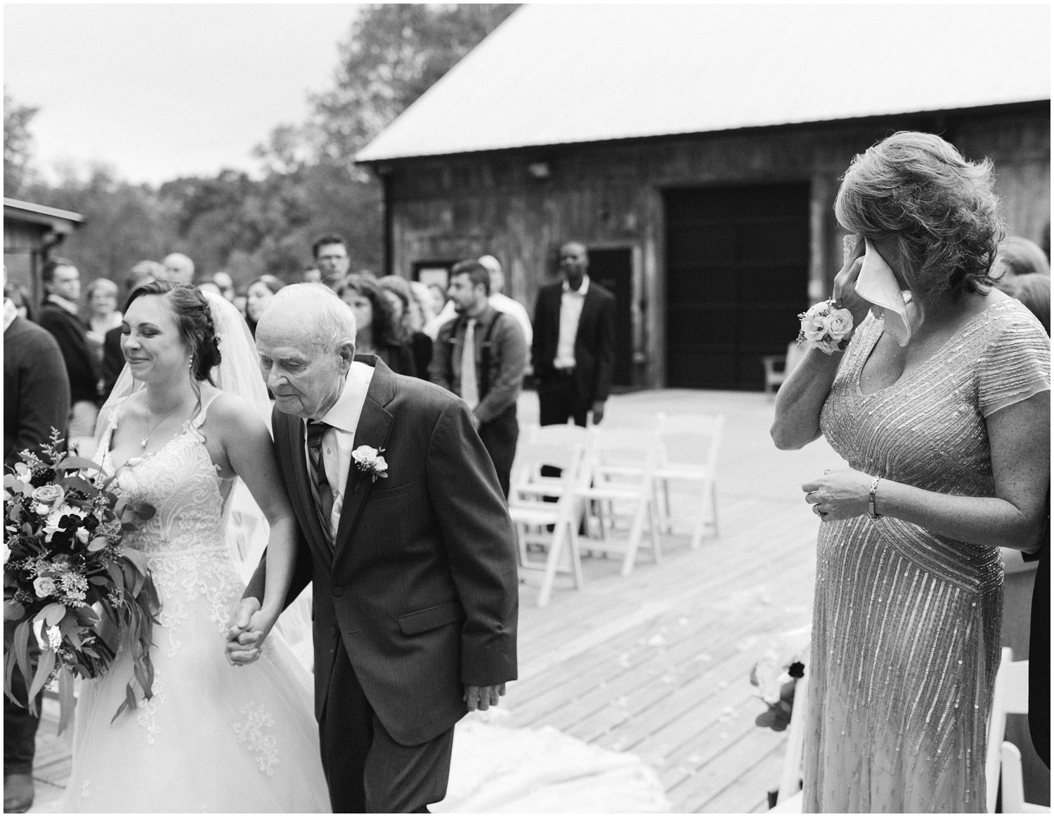 bride walks up aisle with grandfather during NC wedding day 