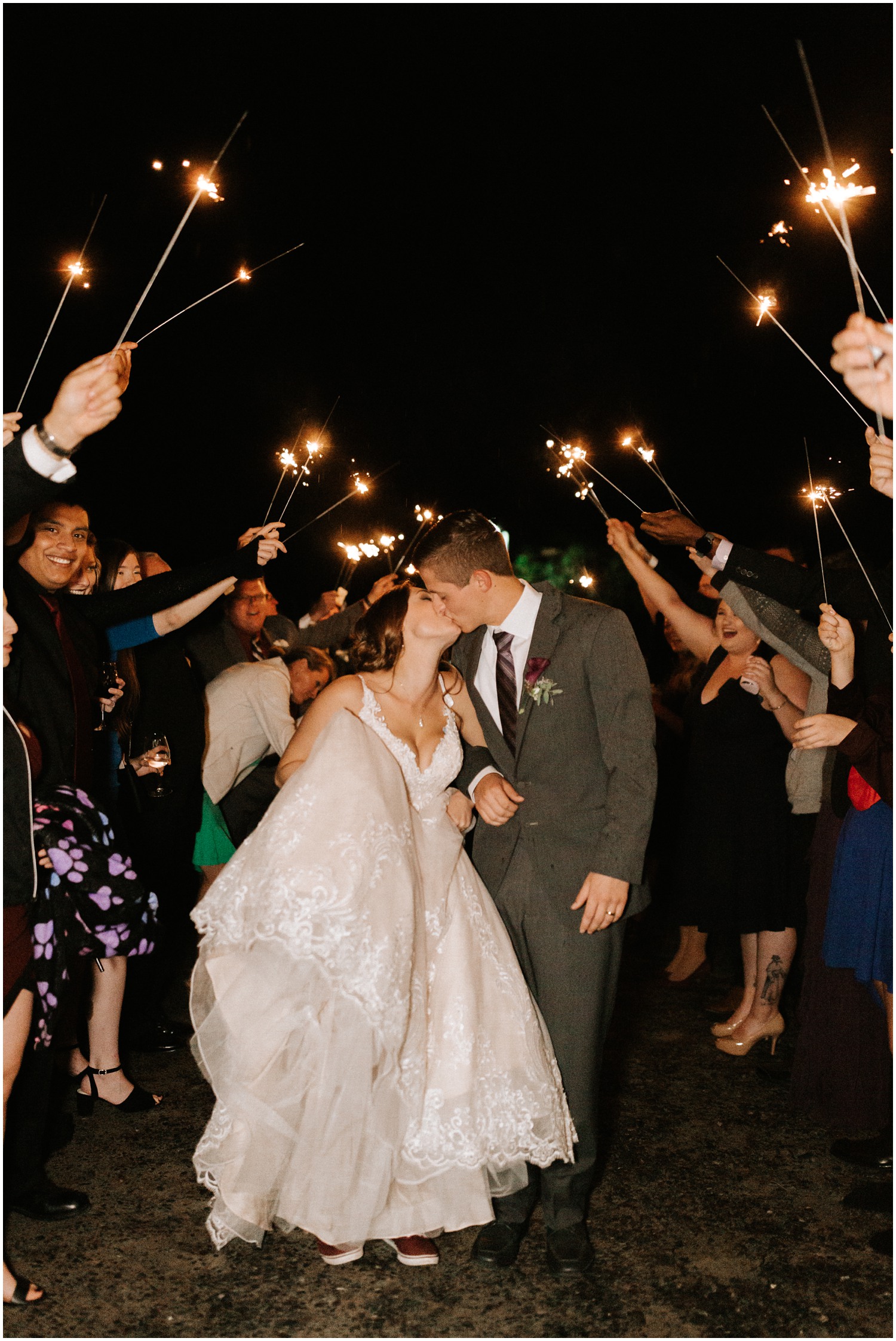 newlyweds kiss during sparkler exit in Lewisville NC