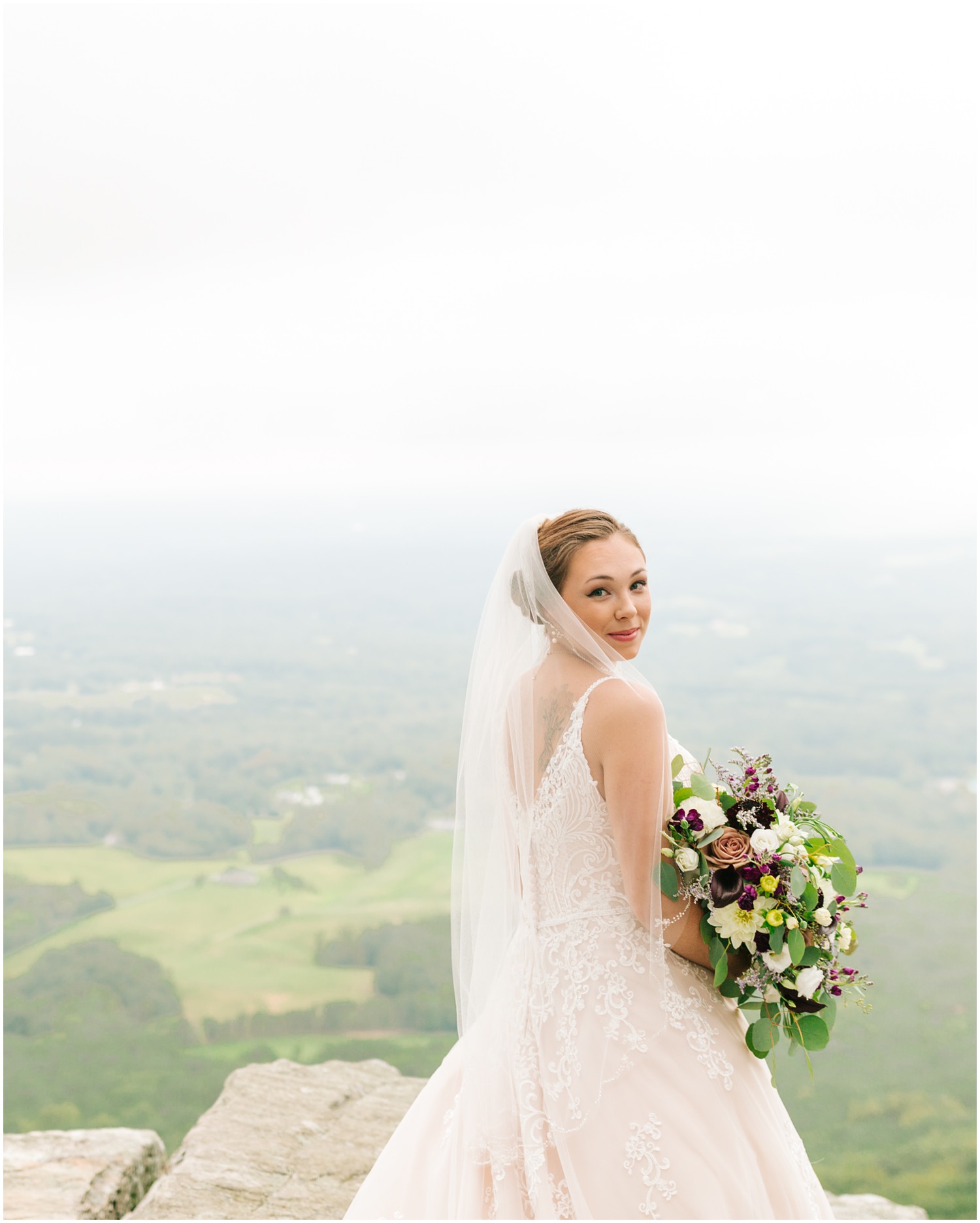 classic bridal photos with veil over bride's shoulders