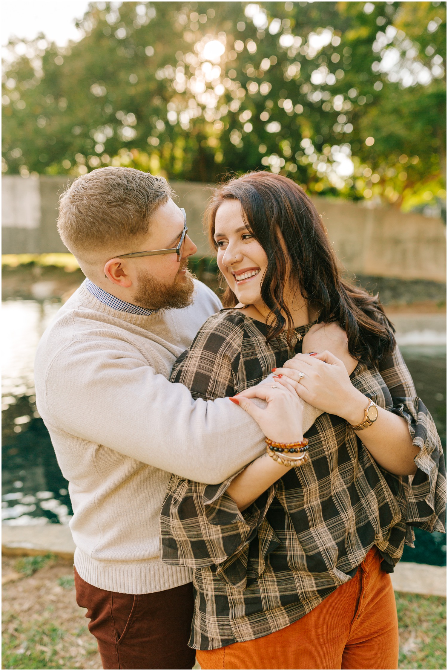 bride and groom laugh during sunset engagement session at Marshall Park 