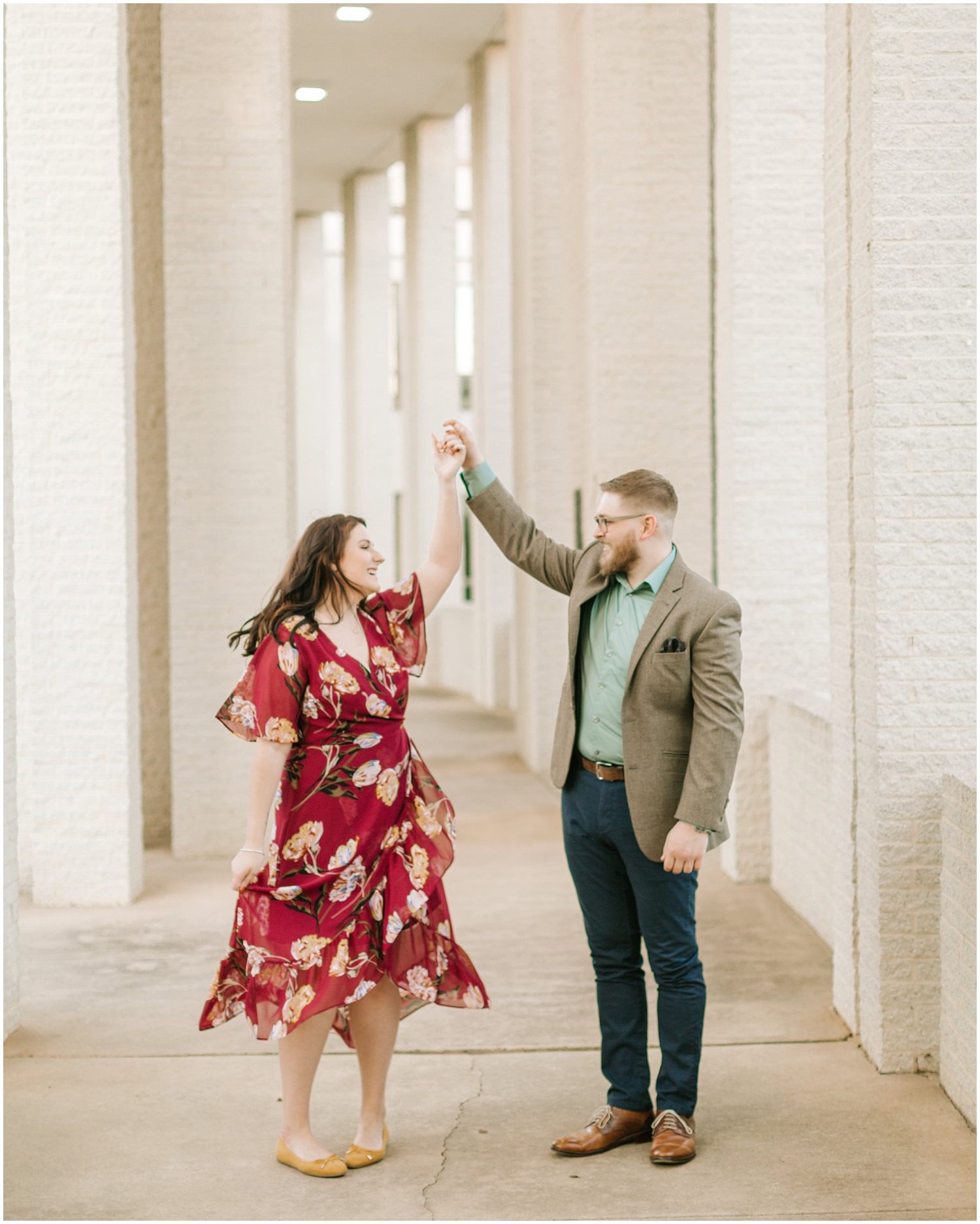 couple dances in Charlotte NC during engagement portraits