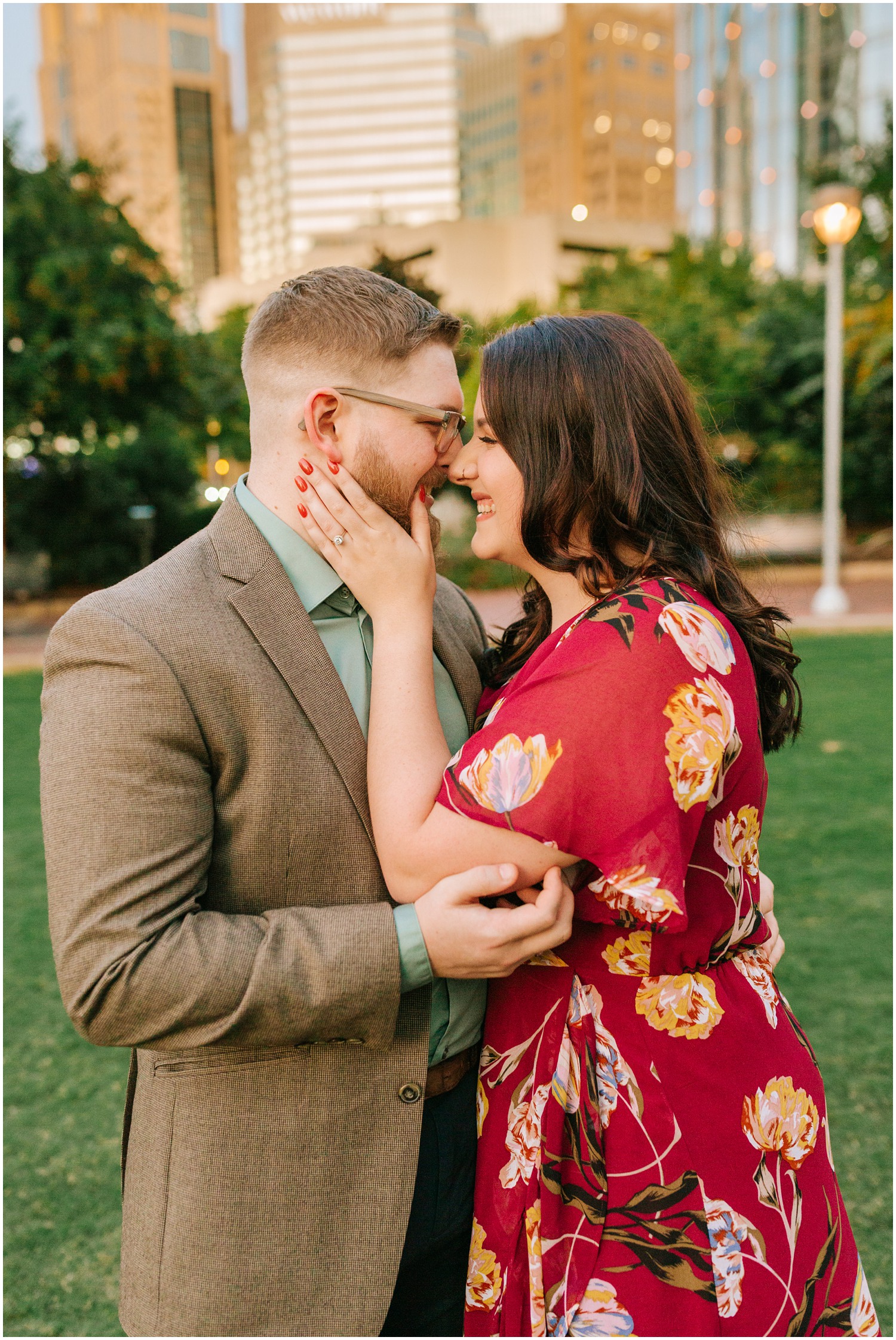 Engagement Session with couple in red dress and brown suit jacket