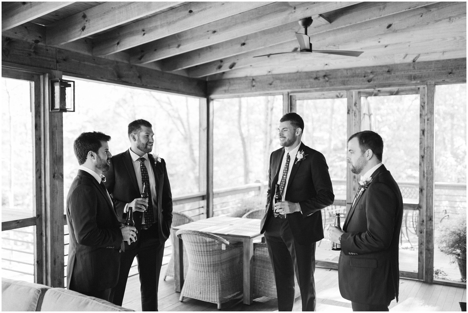 groomsmen stand around and talk before NC wedding