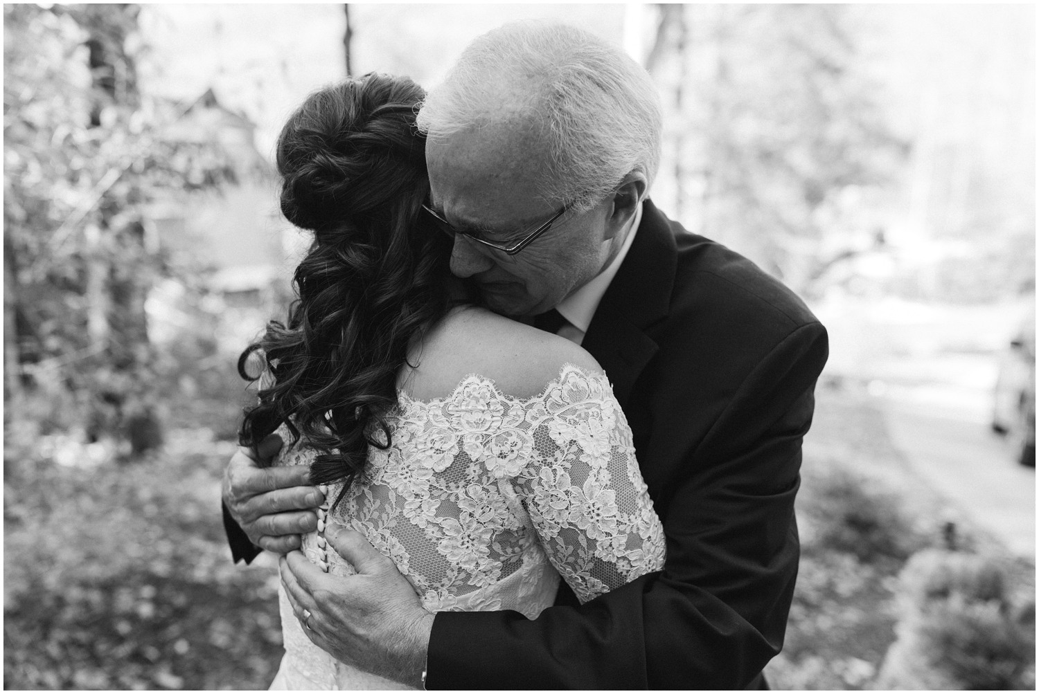 father cries during first look with bride before wedding at Lake Eden Events