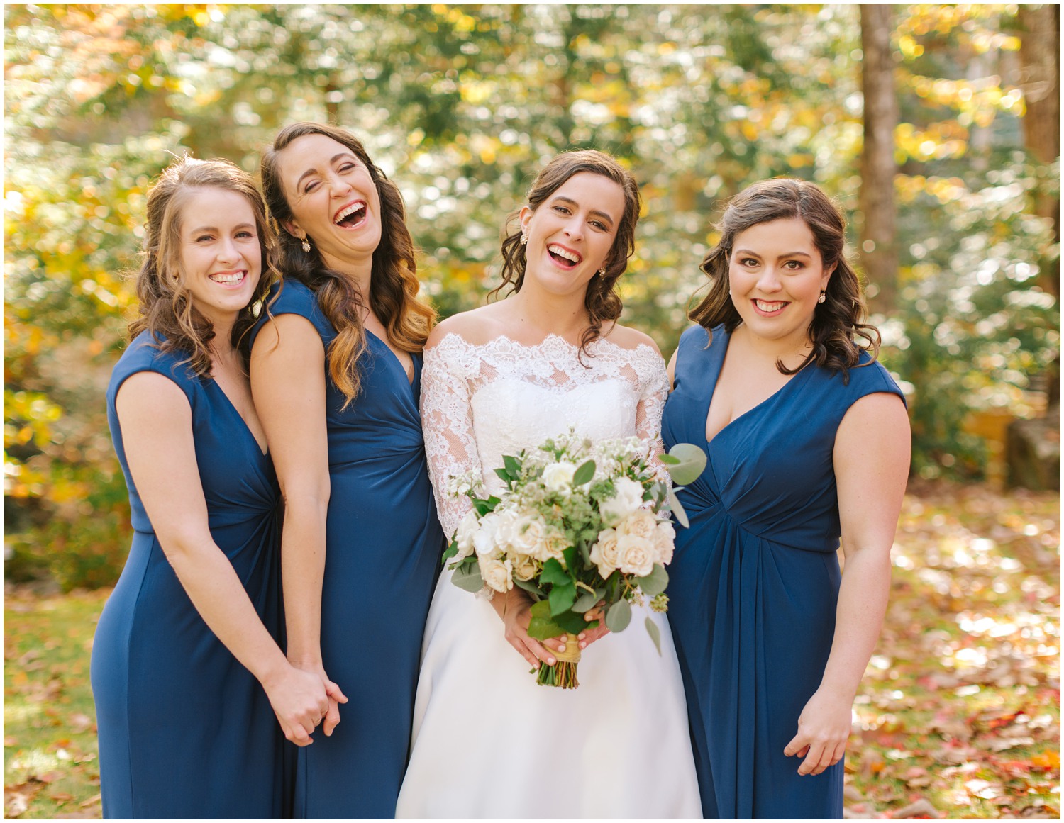 bridesmaids laugh and smile during portraits at Lake Eden Events