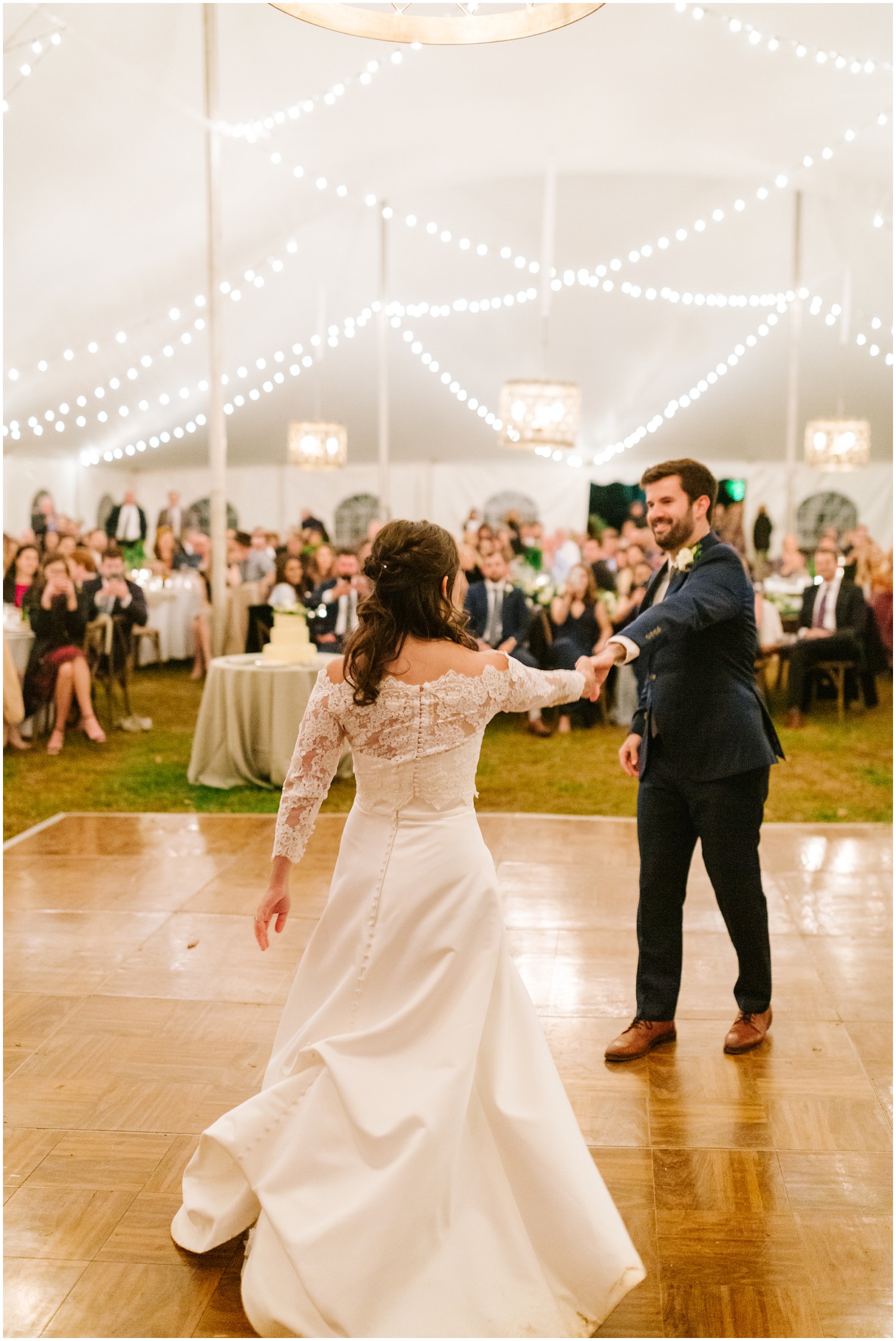 groom twirls bride during first dance at Lake Eden Events