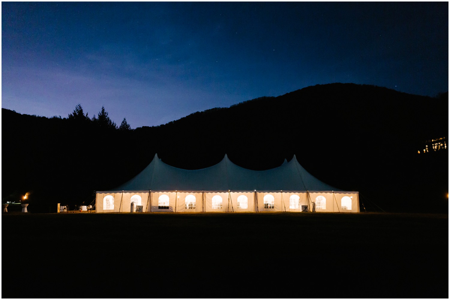 Lake Eden Events wedding reception in tent at dark