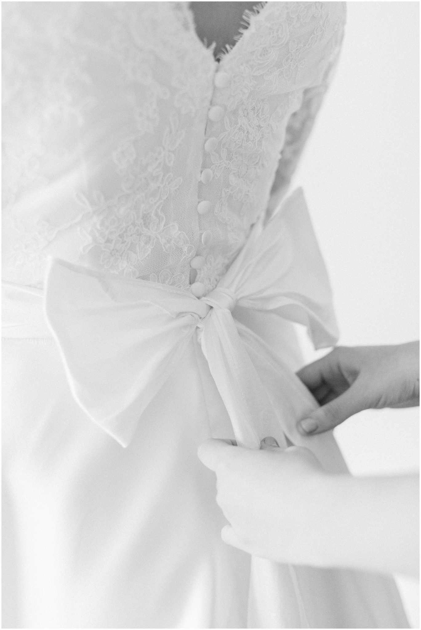lace and bow details of bride's wedding gown