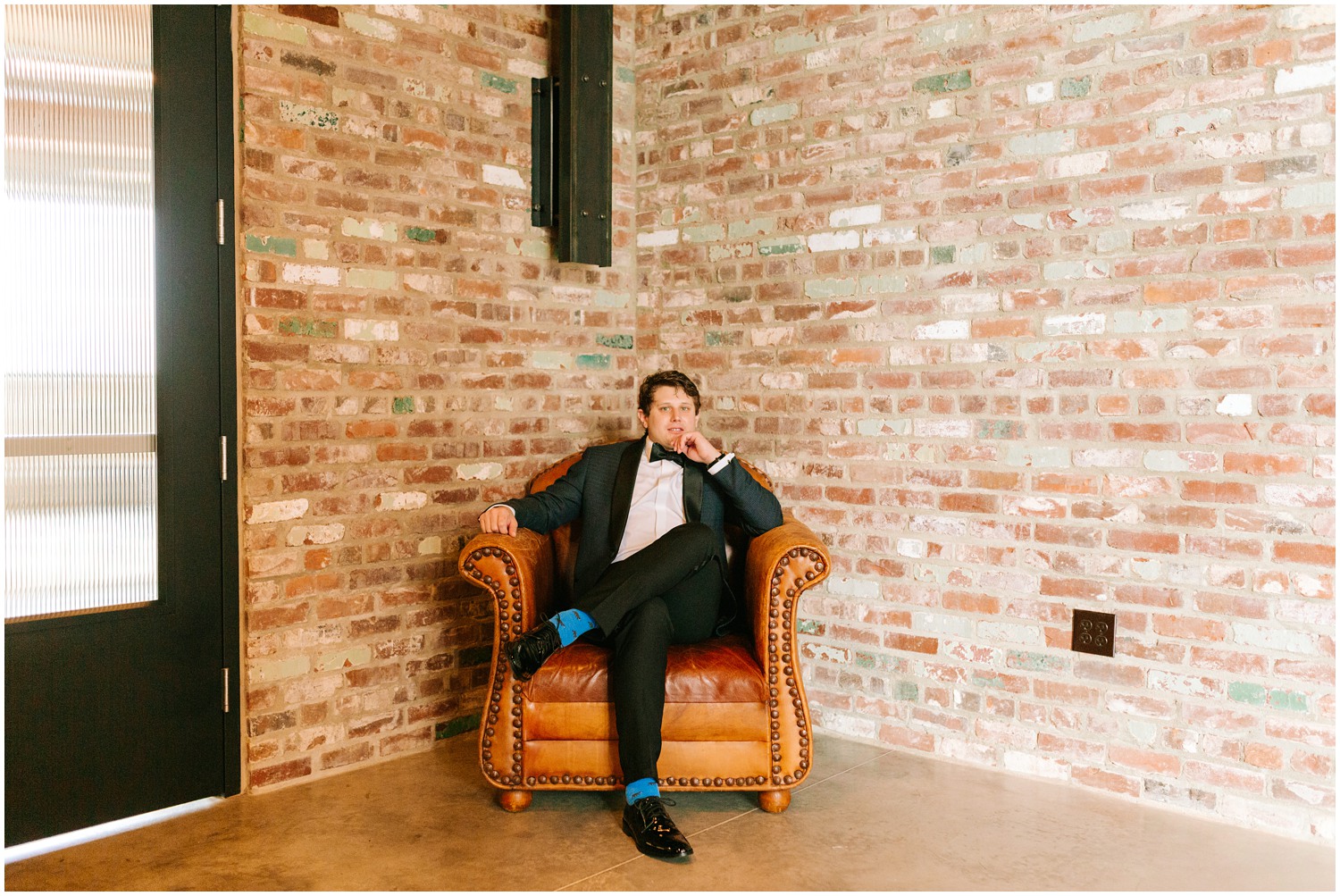 groom's portrait in corner of brick walls by Chelsea Renay Photography