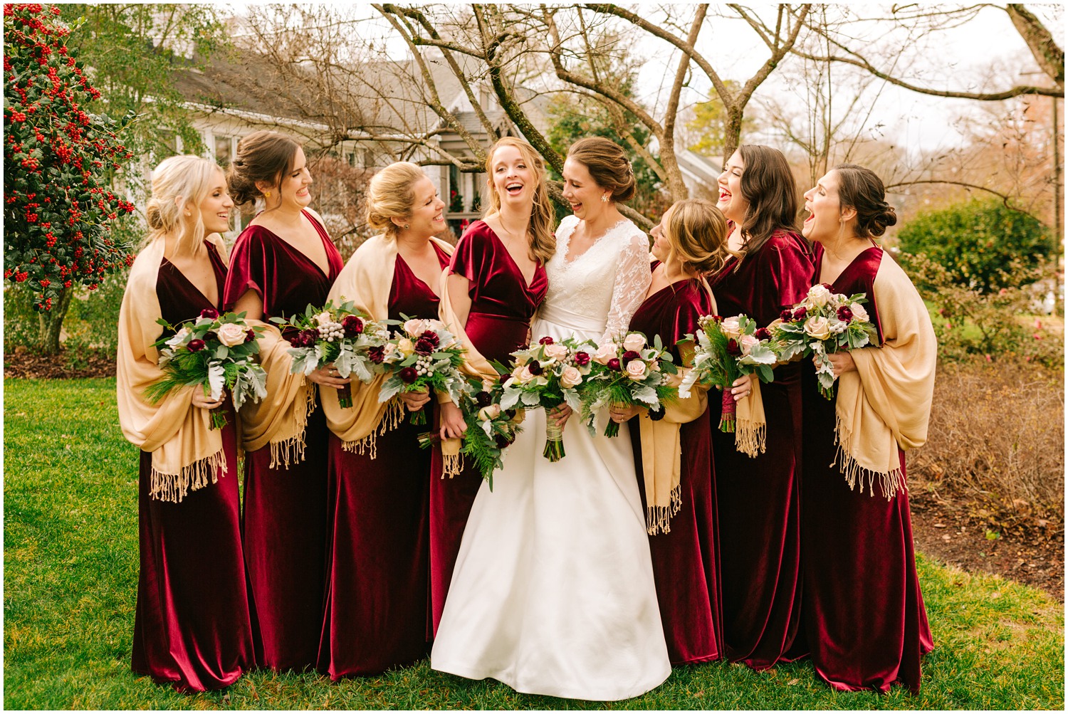 bridesmaids and bride laugh holding pink and red bouquets photographed by Chelsea Renay Photography