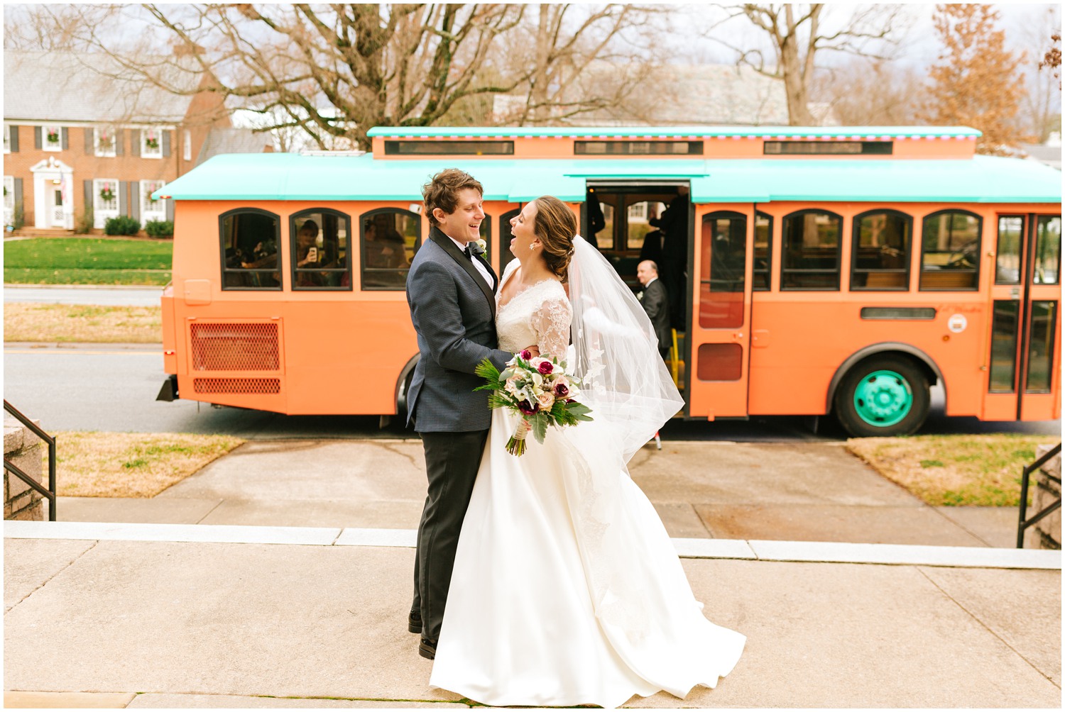 bride and groom pose by trolley for Chelsea Renay Photography