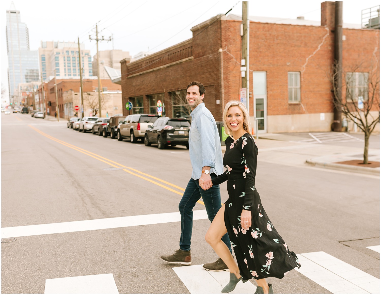 bride and groom walk across street in Downtown Raleigh NC with Chelsea Renay